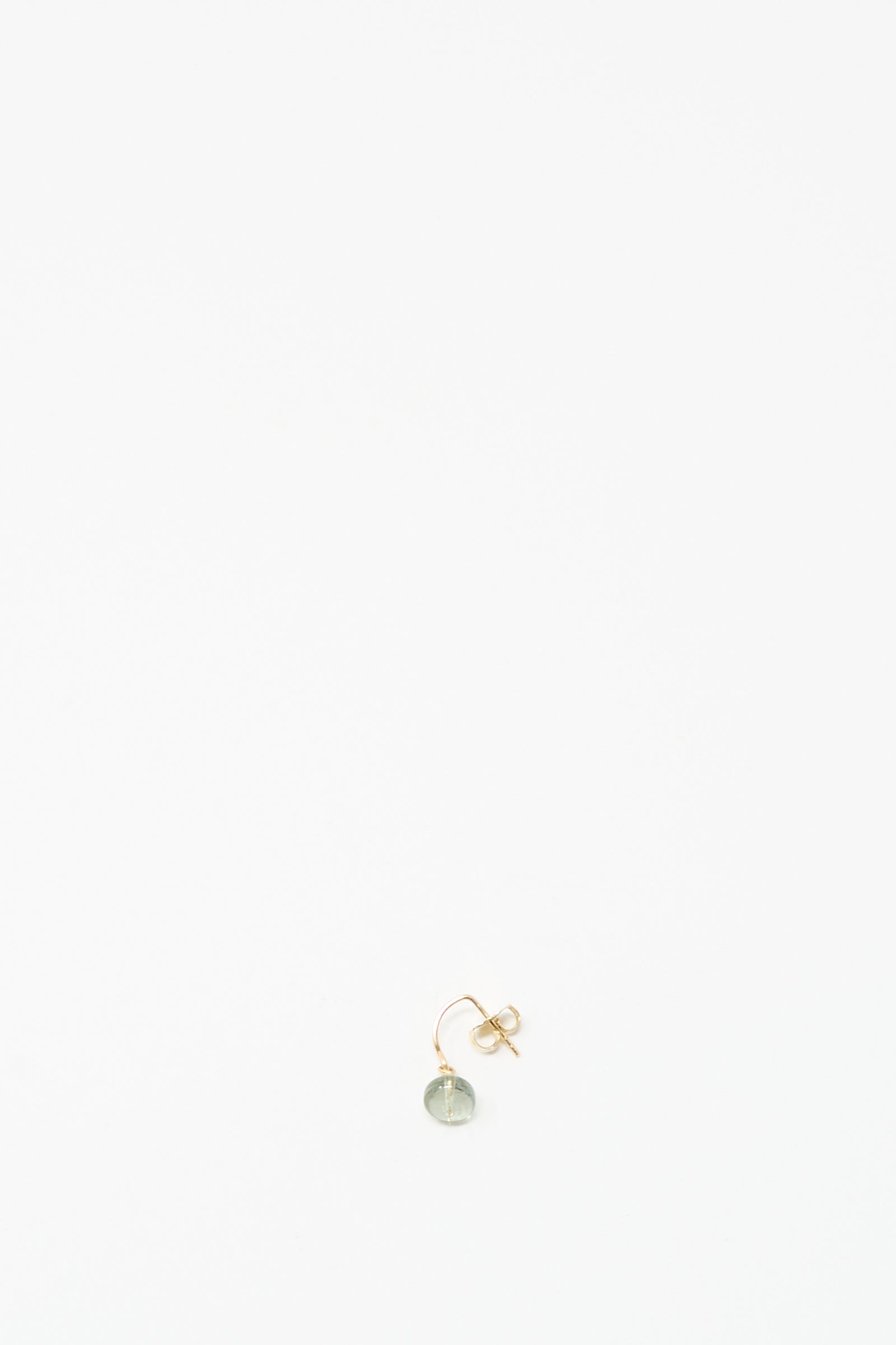 The Mary MacGill 14K Crescent Charm Earring features a small round pale tourmaline stone and is shown on a white background.