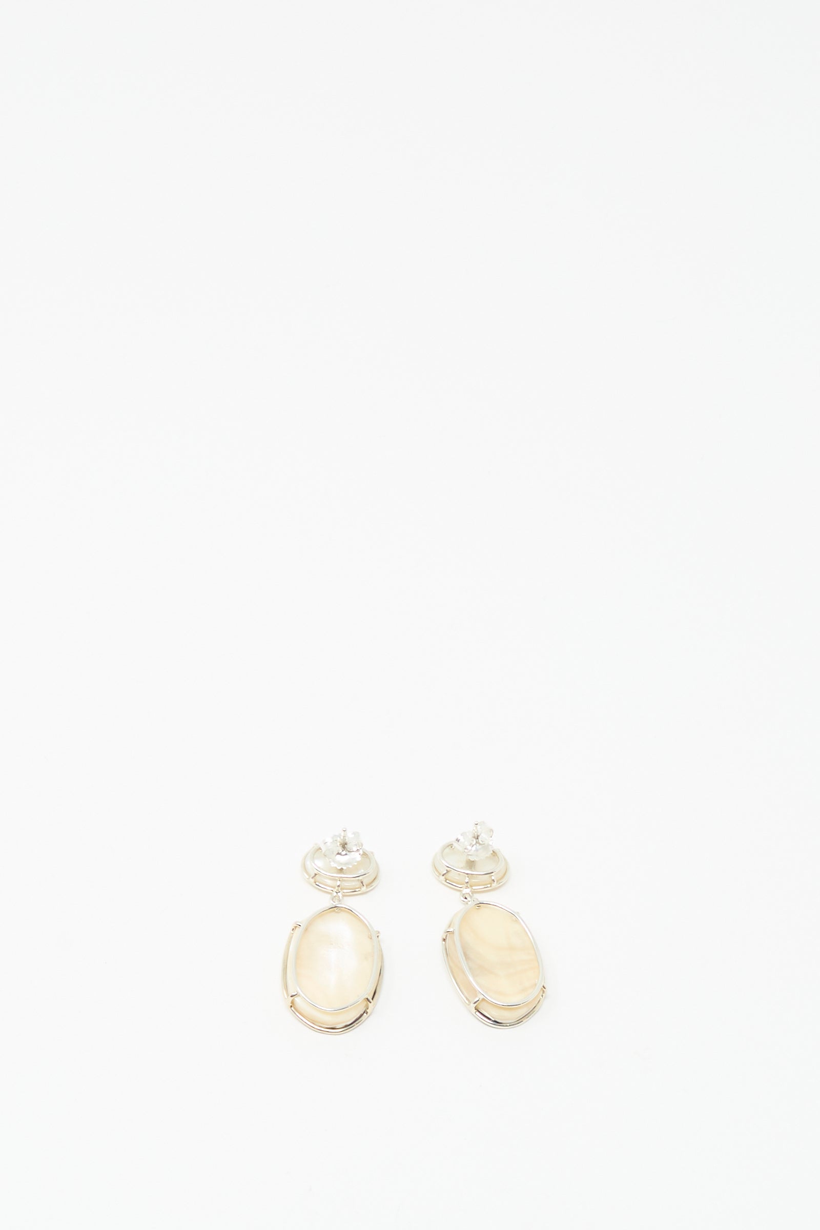The Double Stone Drop Earrings in Moonstone and Cowrie Shell by Mary MacGill, reminiscent of cowrie shell earrings, are displayed on a plain white background.