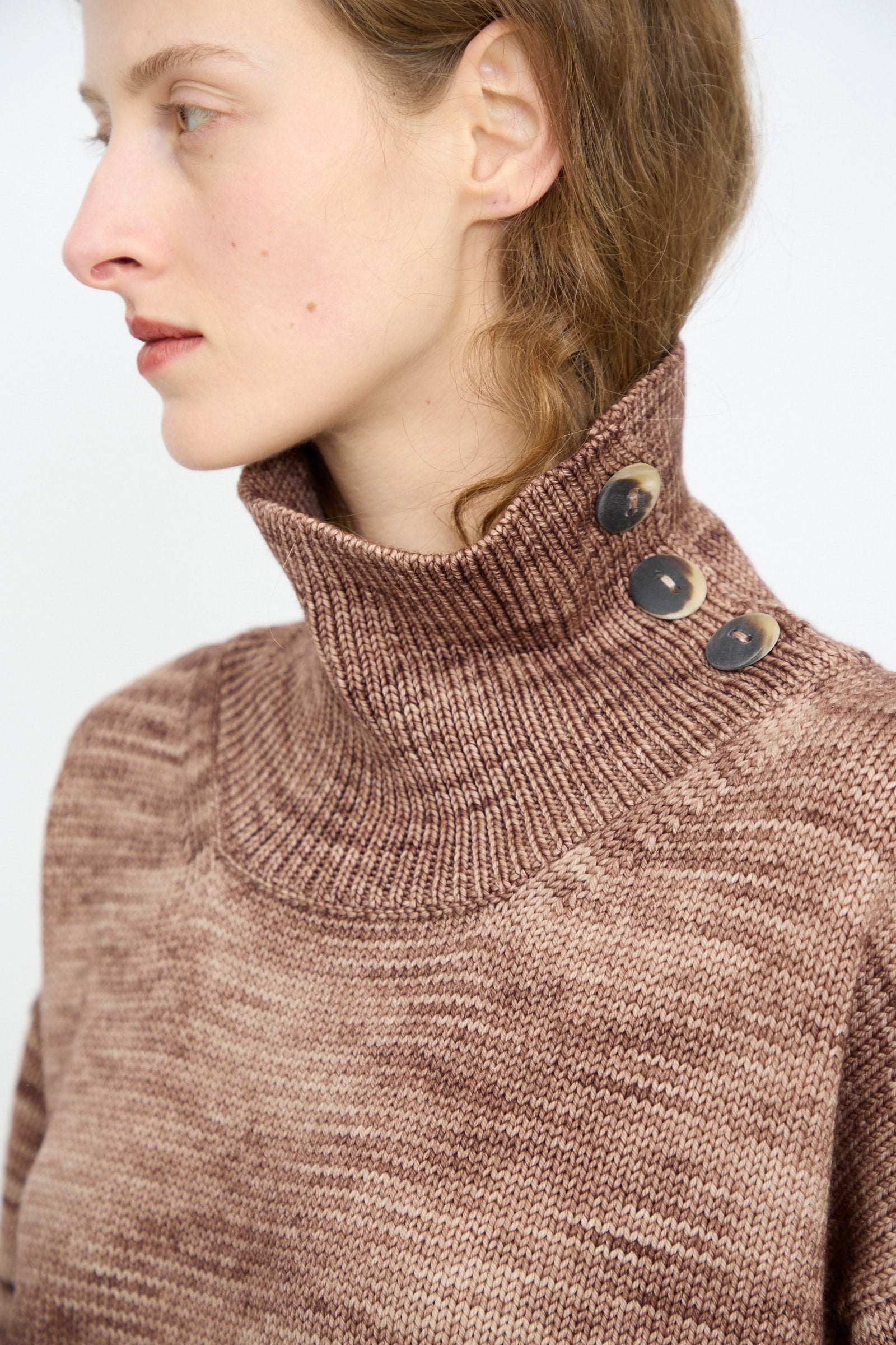 A person shown from the side wearing the Hutton Dress in Affogato by Misha & Puff.