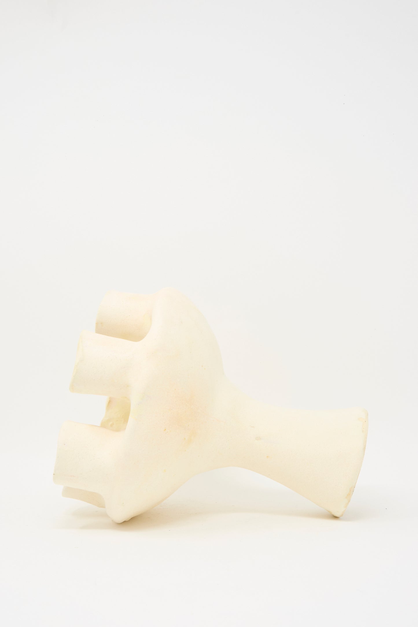 The MONDAYS Glazed Porcelain Tulipiere in White features an abstract, hand-like design with four thick fingers and a short cylindrical base, shown against a plain white background.