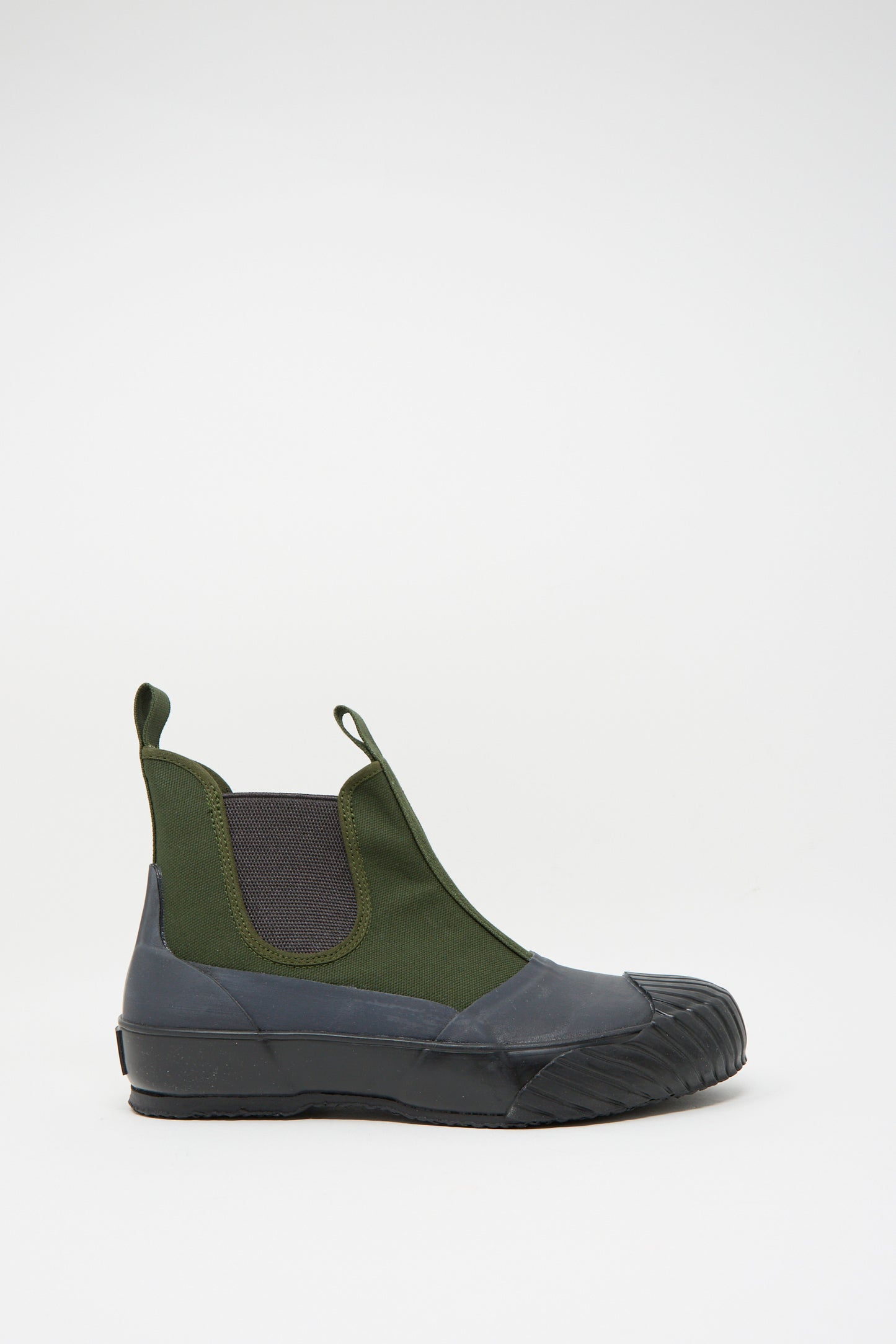 The Alweather Sidegoa in Khaki by Moonstar, made in Japan, is a single boot with a thick rubber sole, side elastic panels, and pull tabs on the heel and ankle, set against a plain white background.