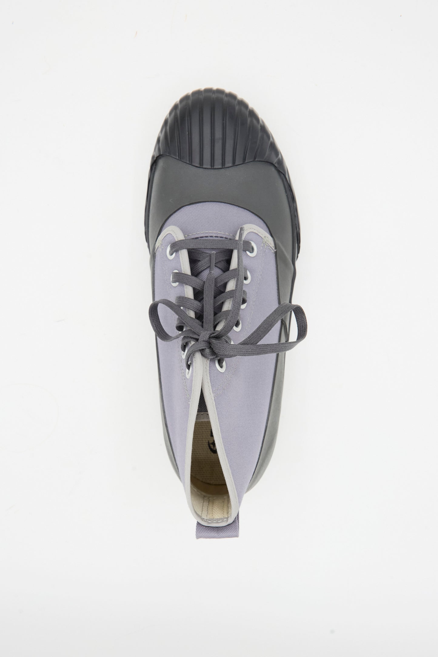 A single Alweather RF Sneaker in Ash by Moonstar, featuring gray canvas and a black rubber toe cap, is shown from above on a white background.