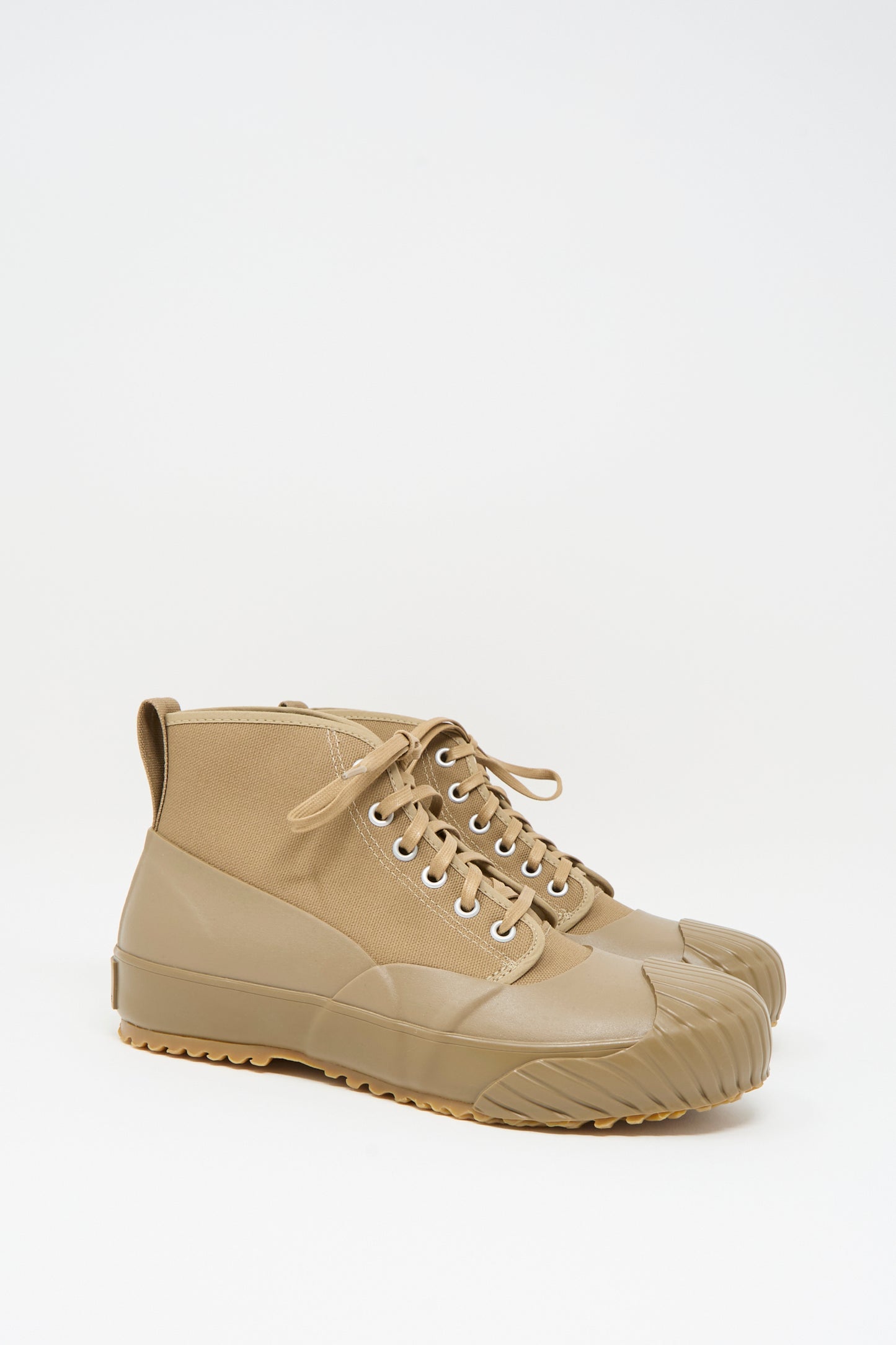 The Moonstar Alweather Sneaker in Light Brown features canvas high tops, lace-up design, and rubberized soles and toe caps, shown against a white background.