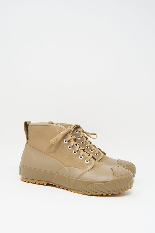 The Moonstar Alweather Sneaker in Light Brown features canvas high tops, lace-up design, and rubberized soles and toe caps, shown against a white background.