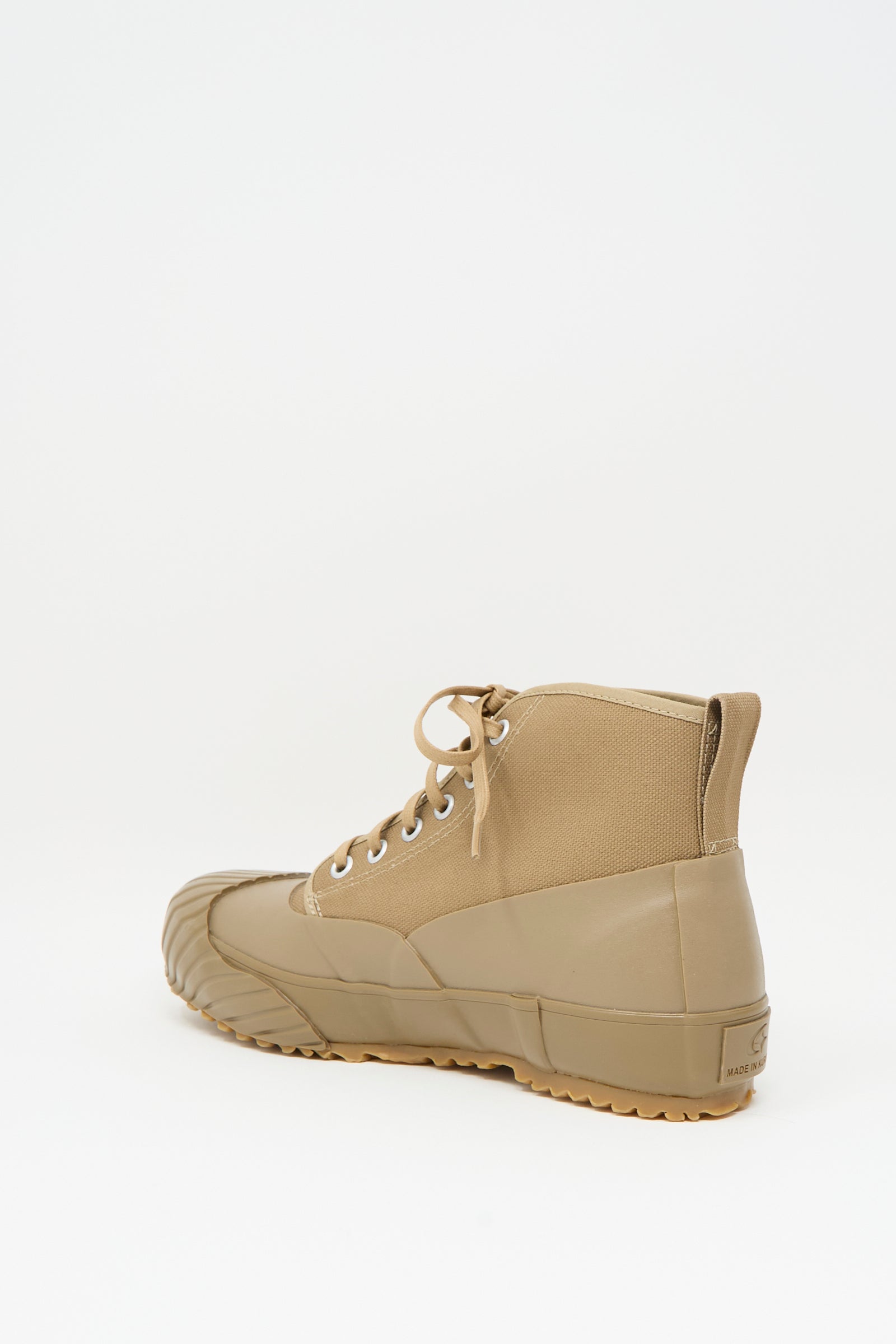 The Moonstar Alweather Sneaker in Light Brown is a single high-top canvas lace-up shoe with a rubber sole and toe cap, shown against a plain white background.