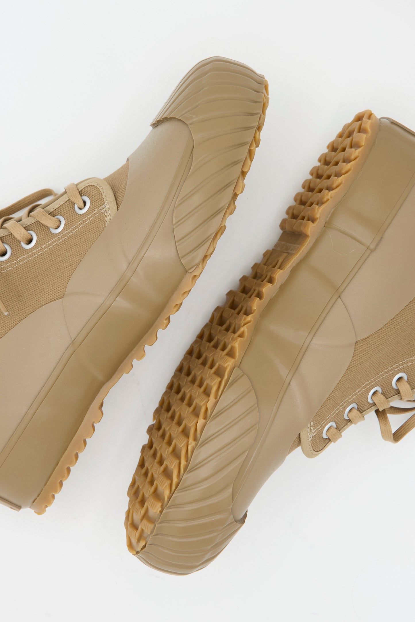 The Moonstar Alweather Sneaker in Light Brown is a pair of high-top canvas lace-up shoes with rugged, textured tan rubber soles, shown from above on a white background.