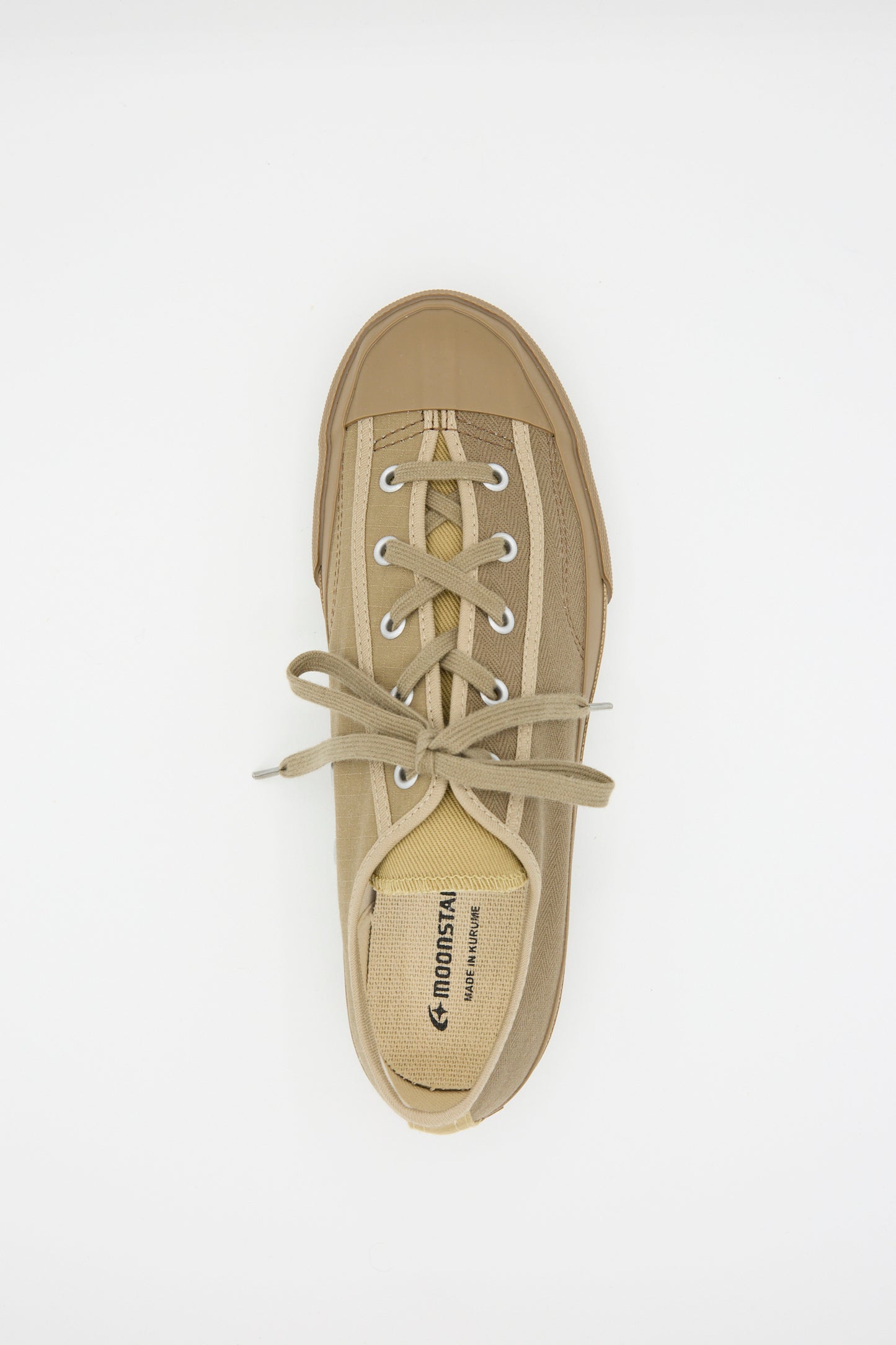 The Gym Classic in Beige Multi by Moonstar is a low-top tan canvas sneaker featuring laces and a rubber toe cap, viewed from above.