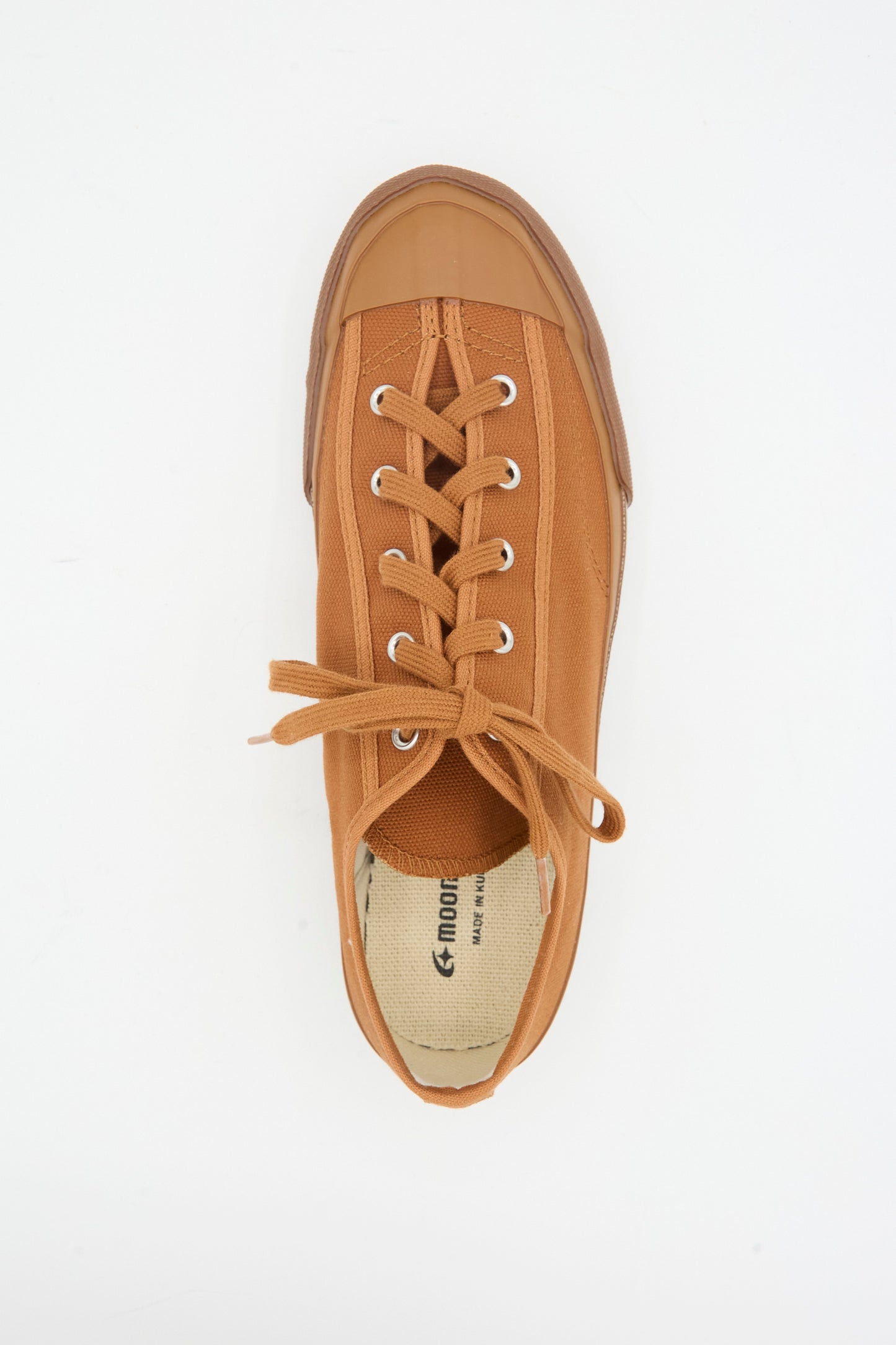 The Moonstar Gym Classic Sneaker in Brick is a single brown canvas shoe, made in Japan, with a rubber toe cap, gum sole, and neatly tied laces, shown from above.