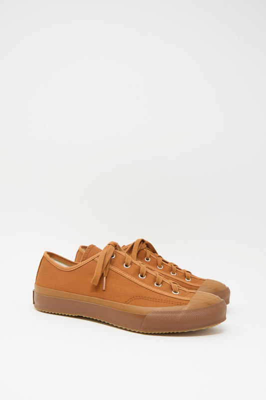 The Moonstar Gym Classic Sneaker in Brick, a brown canvas lace-up shoe with rubber soles made in Japan, is displayed side by side on a plain white background.