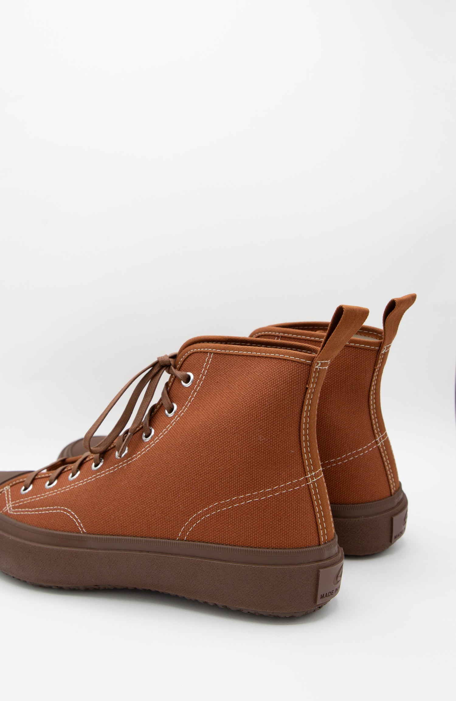 A pair of Moonstar Hibasket Sneakers in Brown with a rubber sole on a white background.