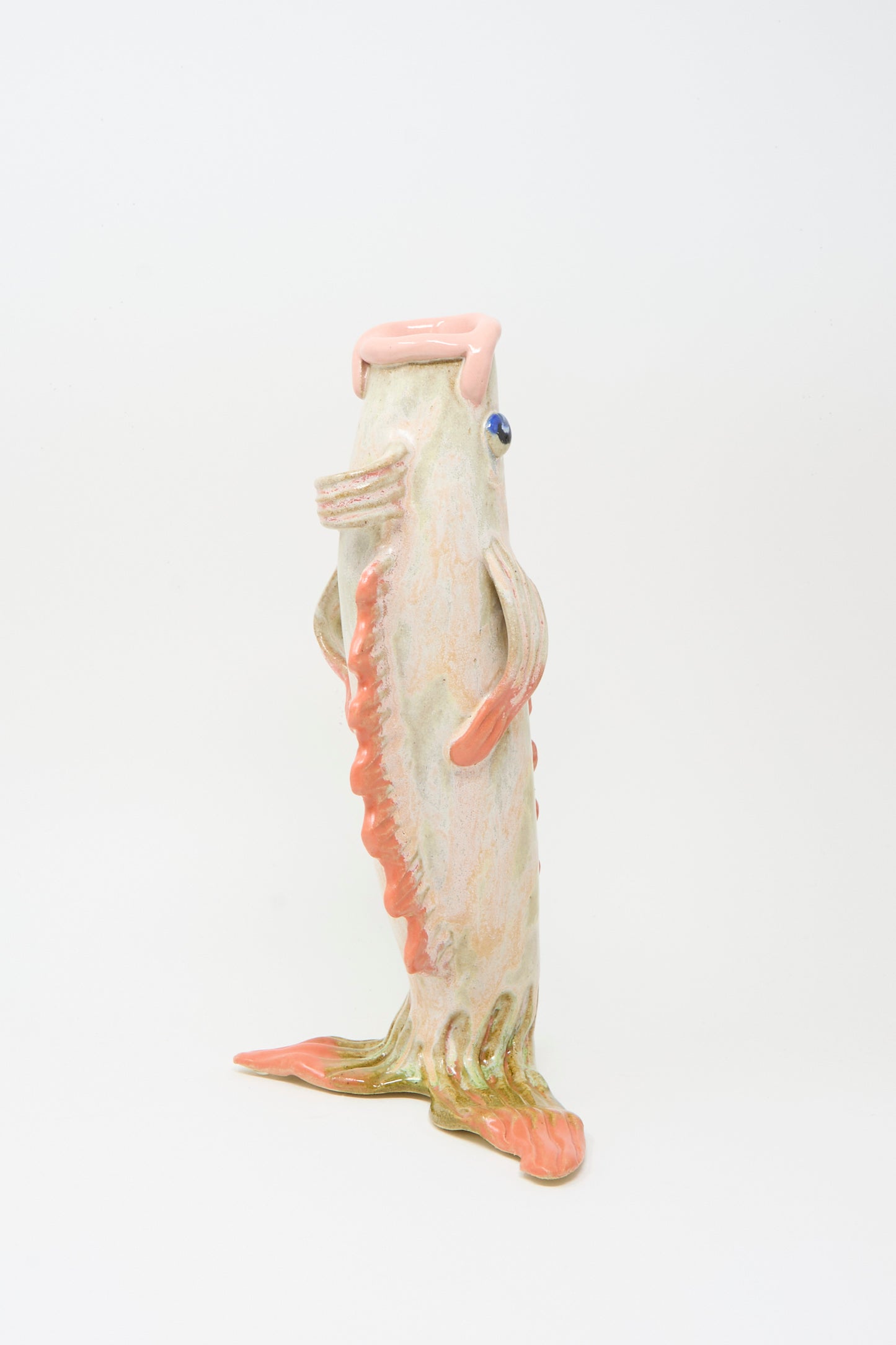 The Fish Vase in Coral II by Pearce Williams features pink and green accents on stoneware, handmade in New Orleans, and stands out against a plain white background.
