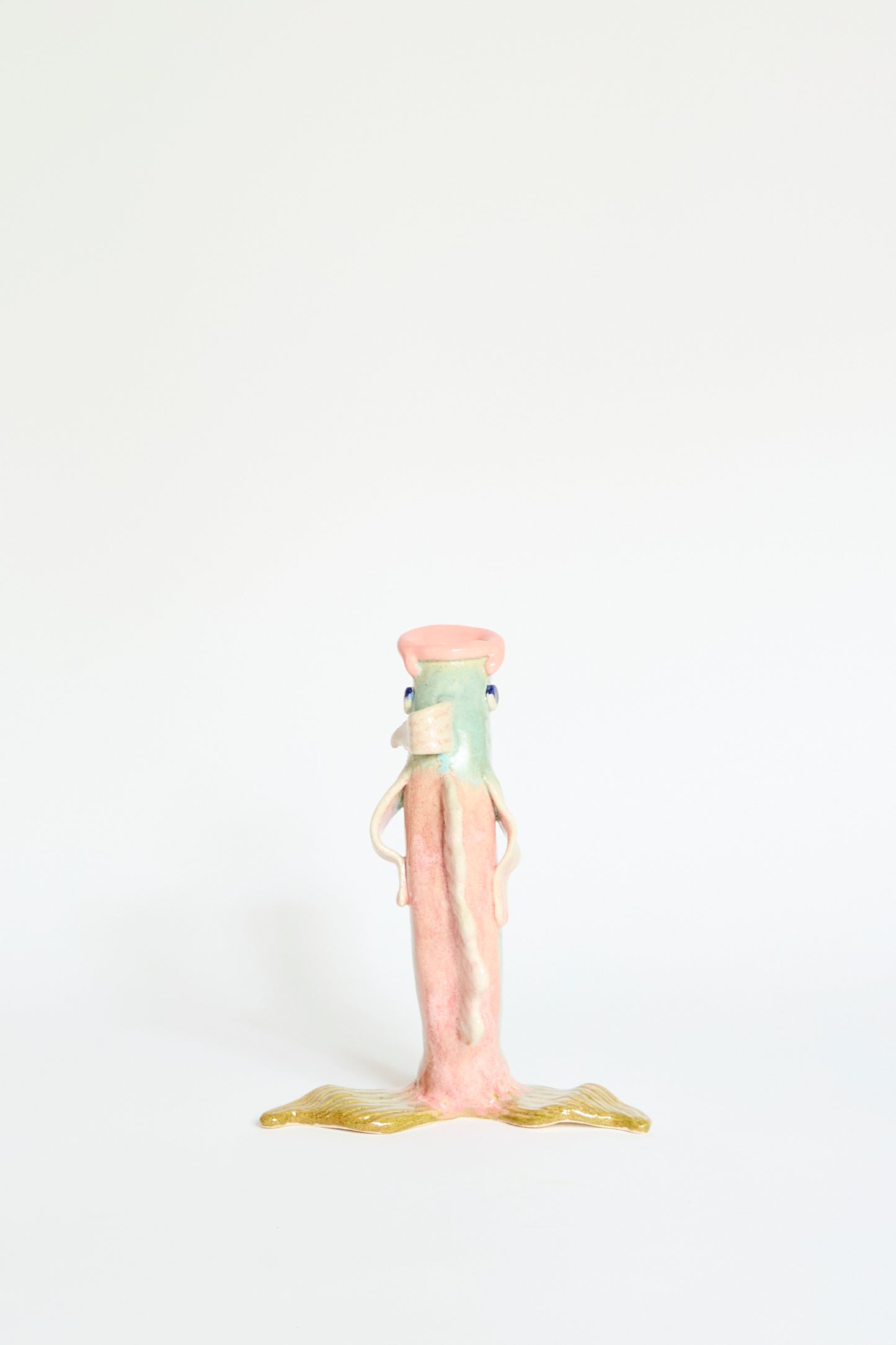 The Fish Vase Small in Green by Pearce Williams is a handmade ceramic piece featuring whimsical artistry, standing upright against a plain white background.