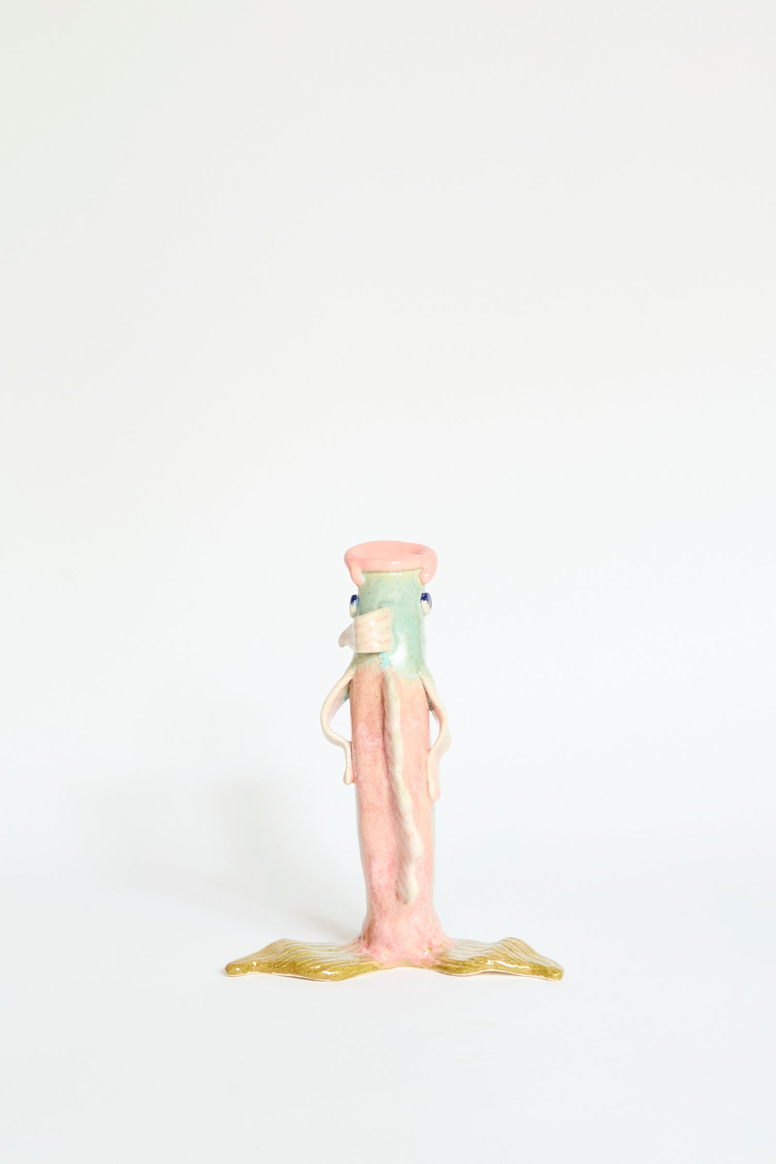 The Fish Vase Small in Green by Pearce Williams is a handmade ceramic piece featuring whimsical artistry, standing upright against a plain white background.
