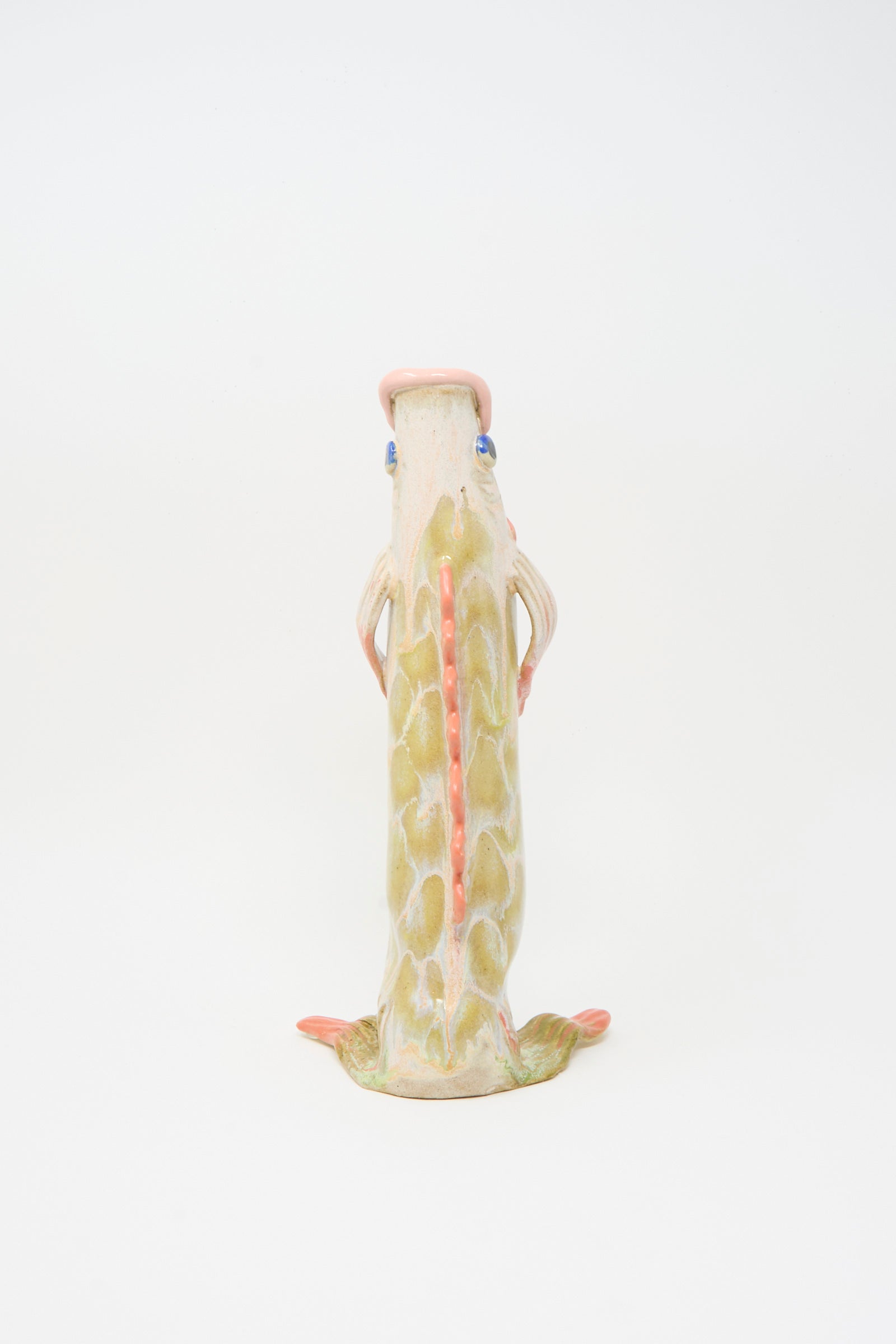 The Fish Vase in Coral III by Pearce Williams is a fish-shaped sculpture with green and pink glazes, textured surface, and bold fins.