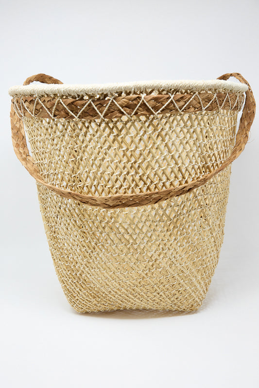A Plaza Bolivar Niga Carry-On Basket with handles on a white background.