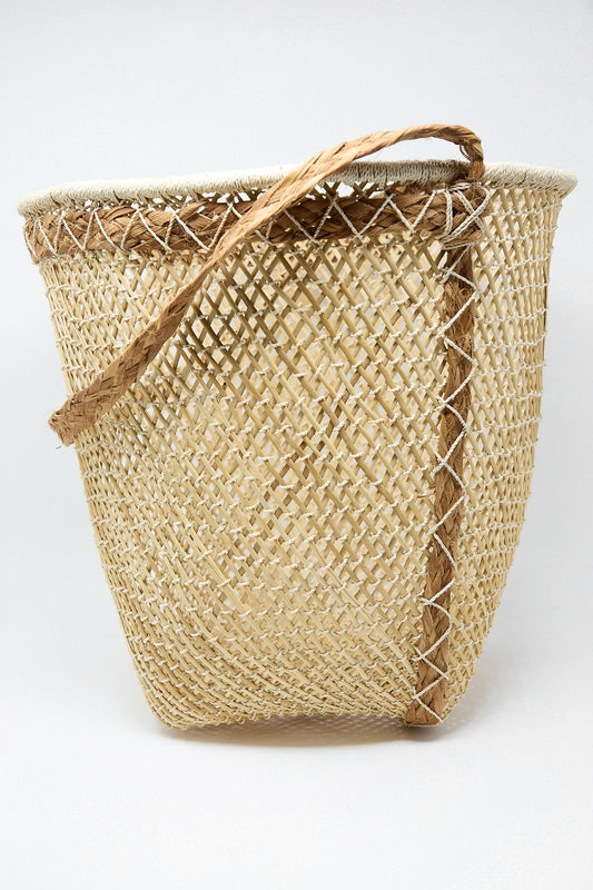 A Plaza Bolivar artisanal Niga Carry-On Basket with handles on a white background.
