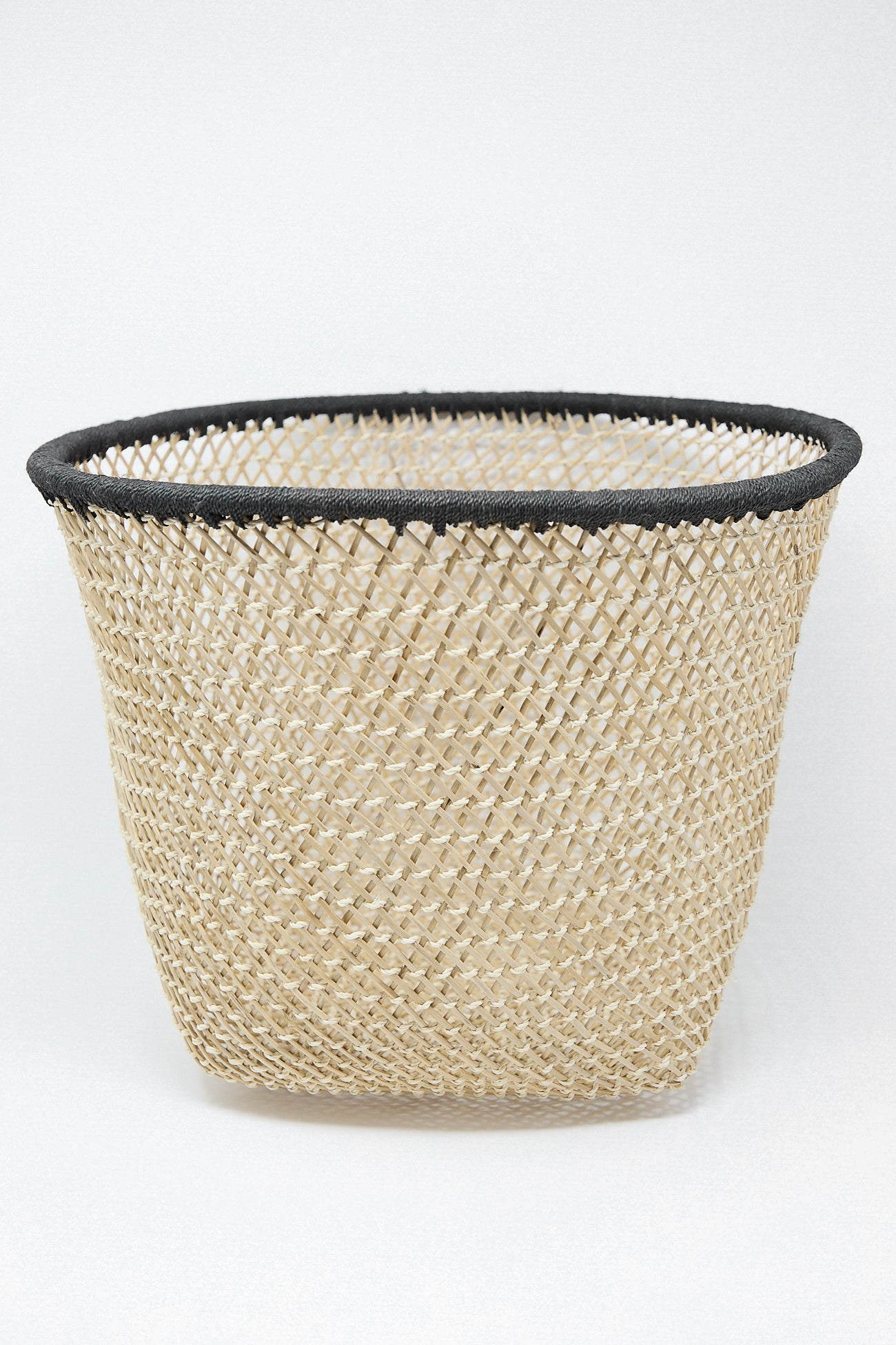 Plaza Bolivar's Niga Open Weave Basket in Black, featuring black trim on a white background, from Colombia.