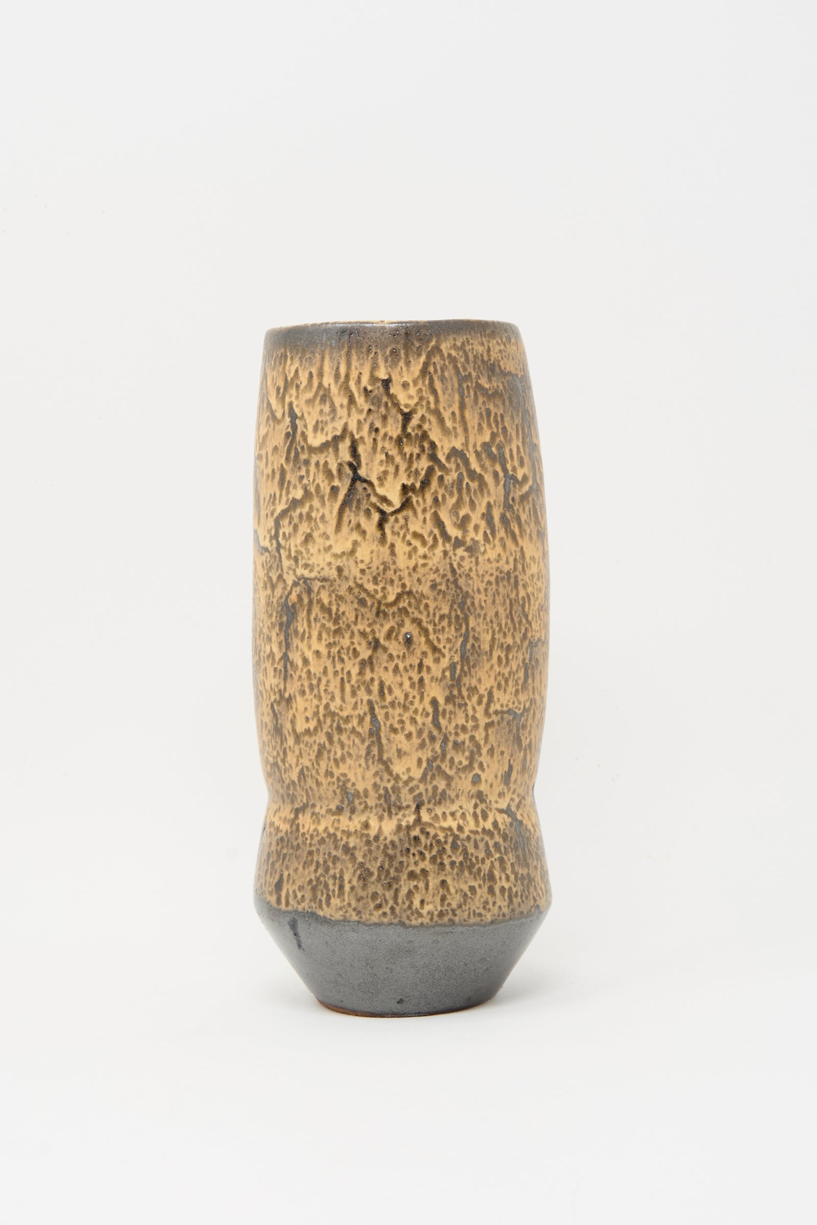 The Tall Sap Vase in Brown by Rachel Craven features a handmade, textured brown and tan surface with a slightly flared base, displayed against a plain white background.