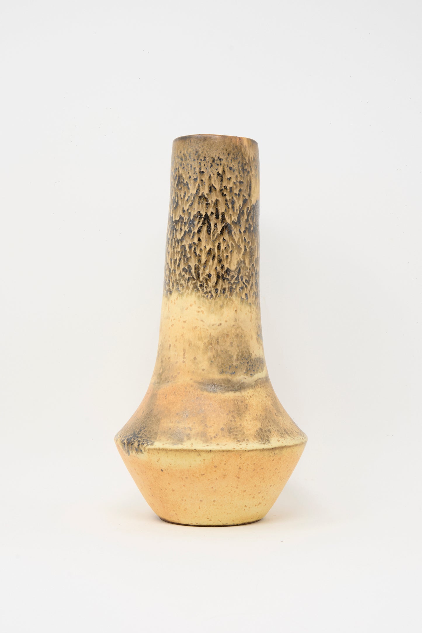 The Tall Variegated Vase in Black and Brown by Rachel Craven features a wheel-thrown design with a narrow neck, wide base, and textured surface, showcased against a plain white background.