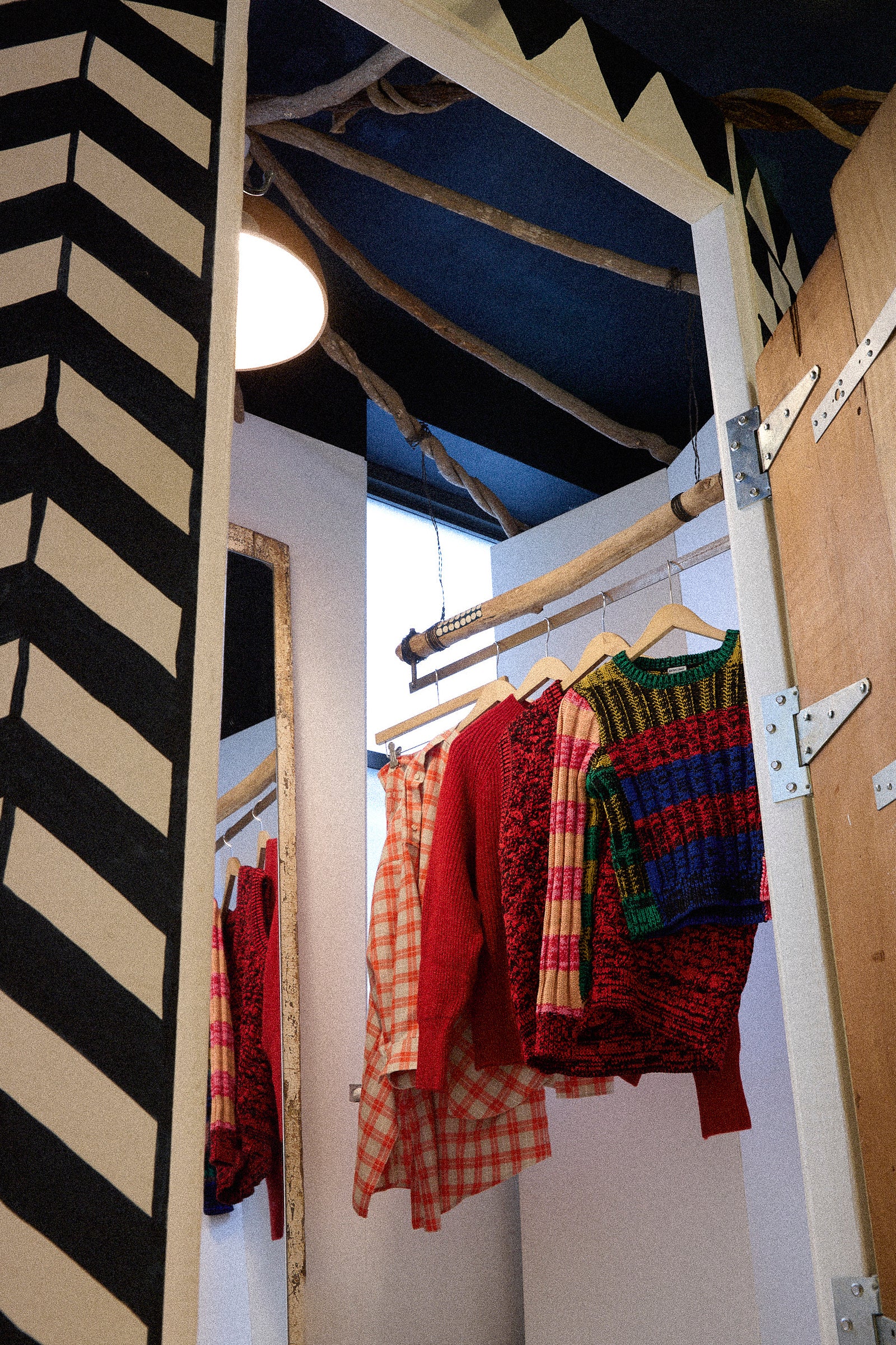 An image of Oroboro's fitting room with Rachel Comey's PS26 collection hanging on the rack.