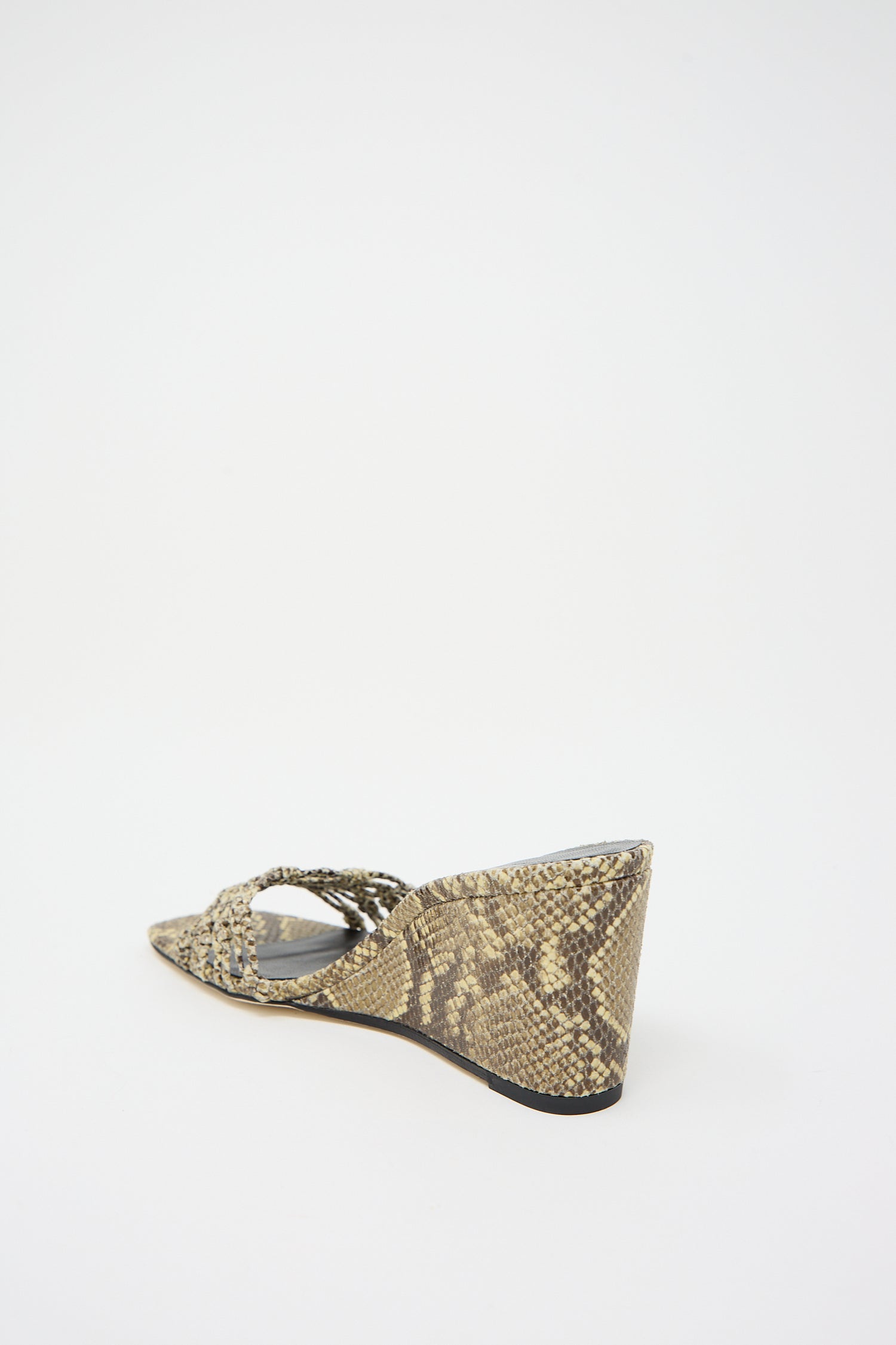A single Rejina Pyo Leather Print Kyle Wedge in Snake Butter with a woven front strap against a white background.