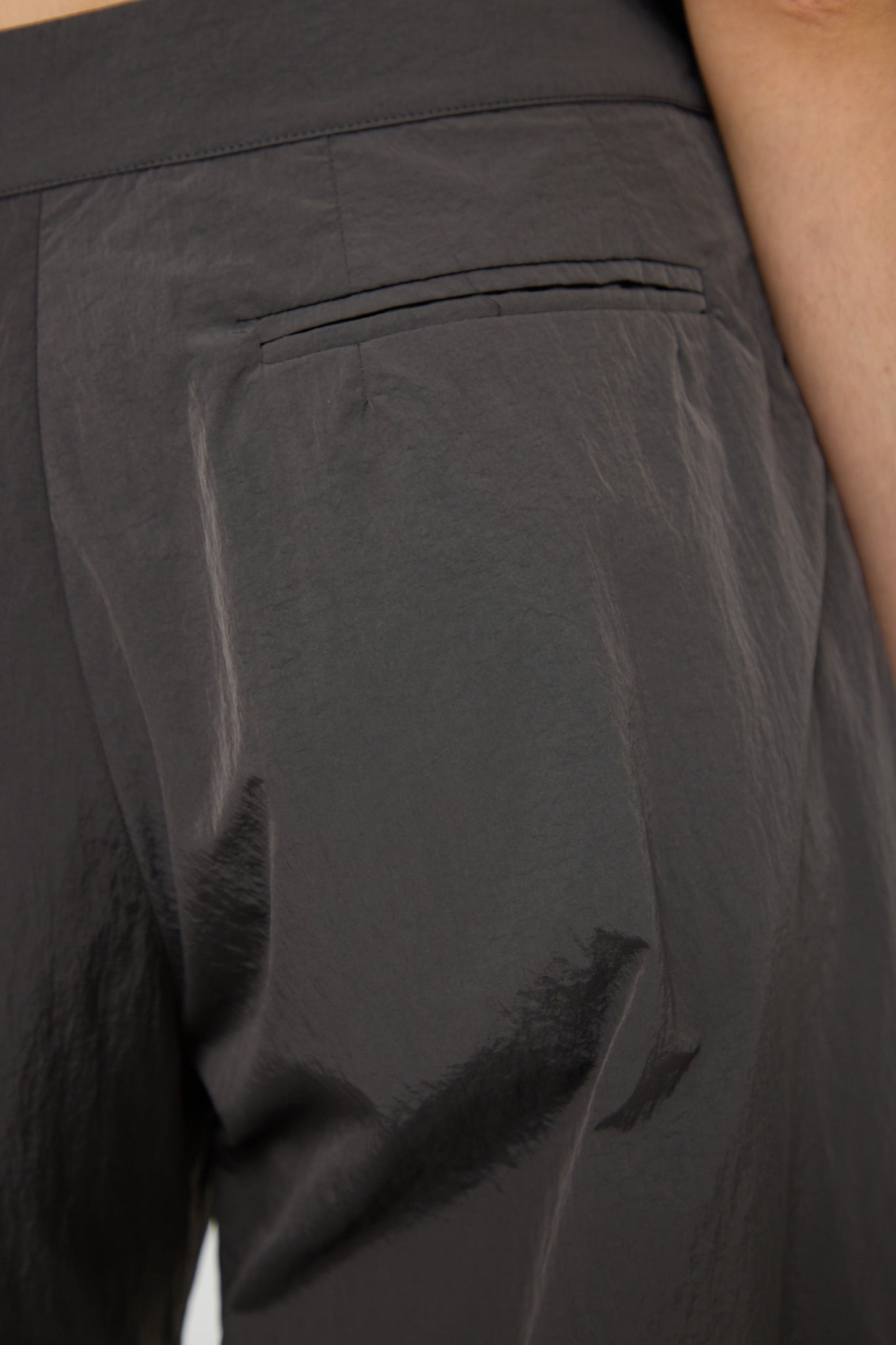 The back view of a woman's Mare Trouser in Deep Grey with Renata Brenha water repellent coating.