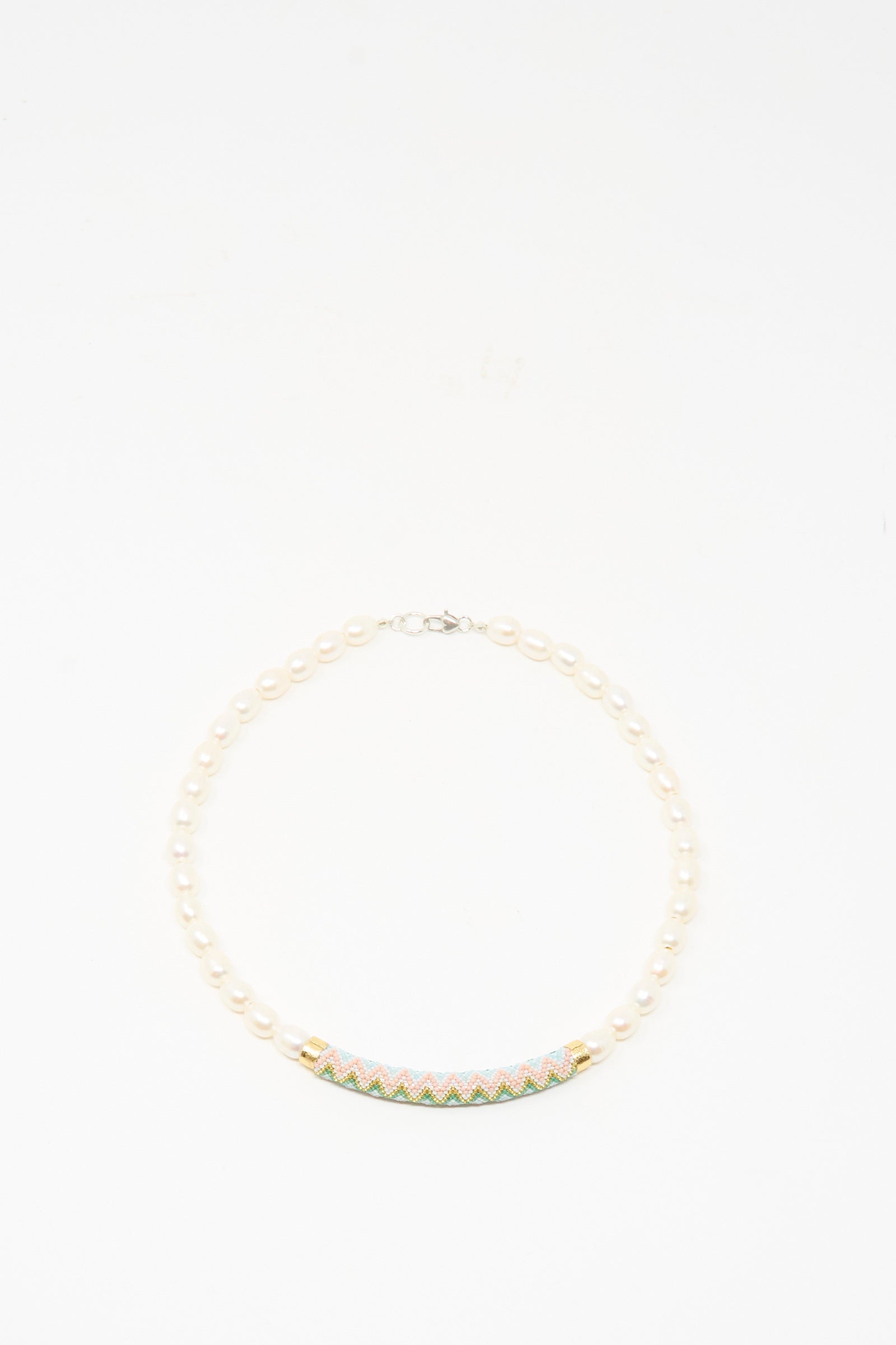 The Robin Mollicone Beaded Bar Necklace in Freshwater Pearl features a colorful, patterned curved bar centerpiece and sterling silver findings, shown on a white background.