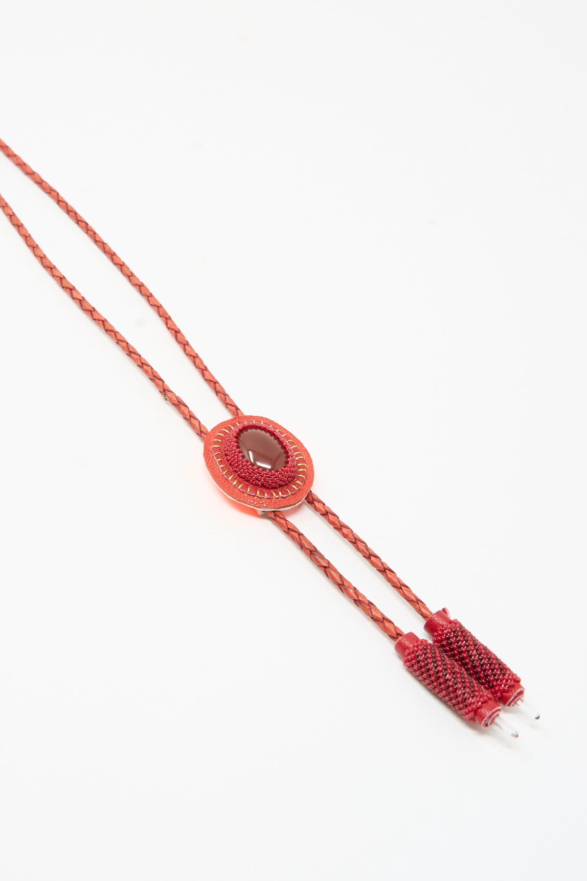 Robin Mollicone Bolo Necklace in Red Carnelian featuring an oval pendant with a red stone, braided cords, and matching tips.