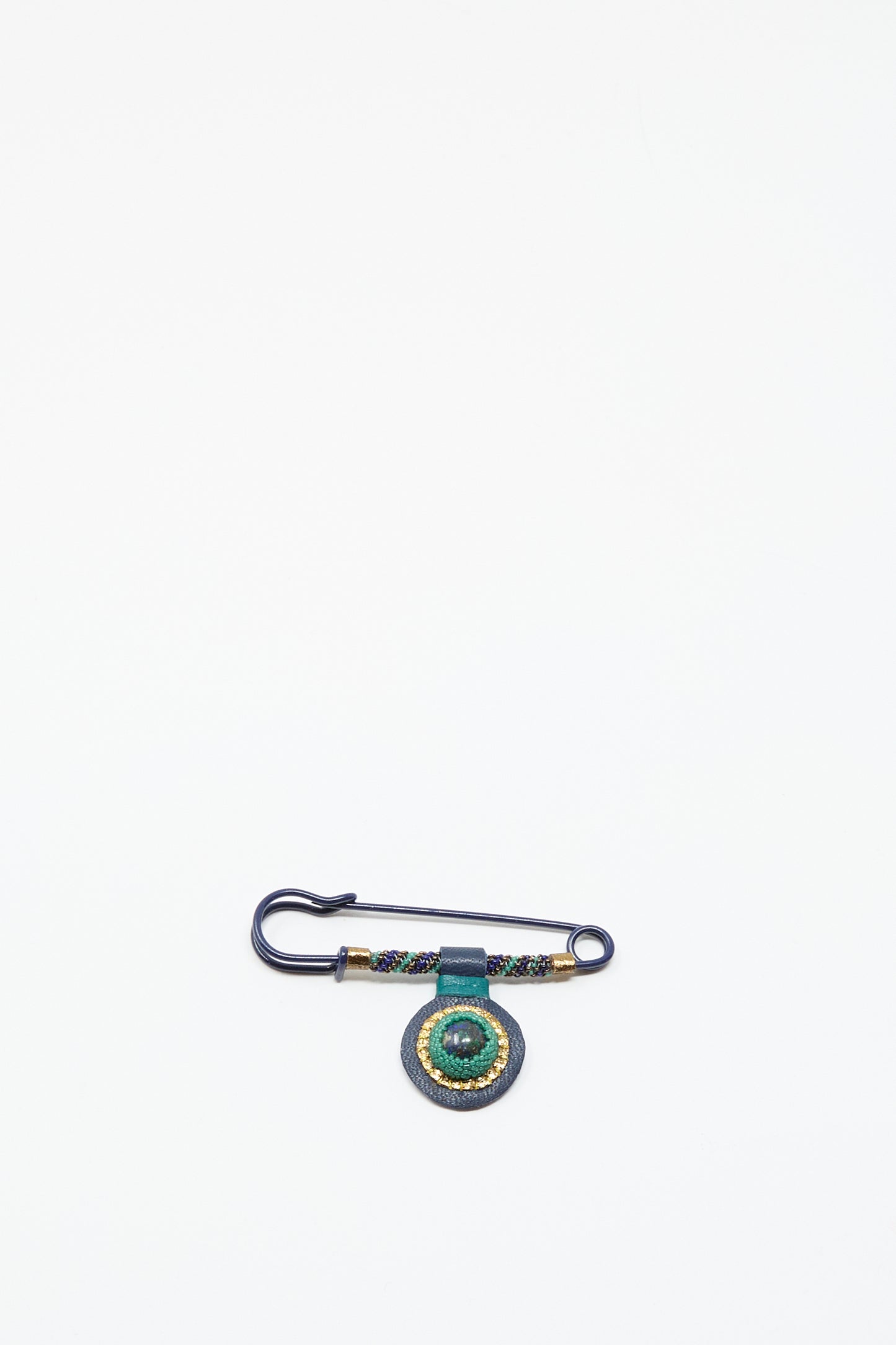 The Robin Mollicone Gem Drop Safety Pin in Blue with Azurite features antique glass beads and a green circular ornament, displayed on a white background.