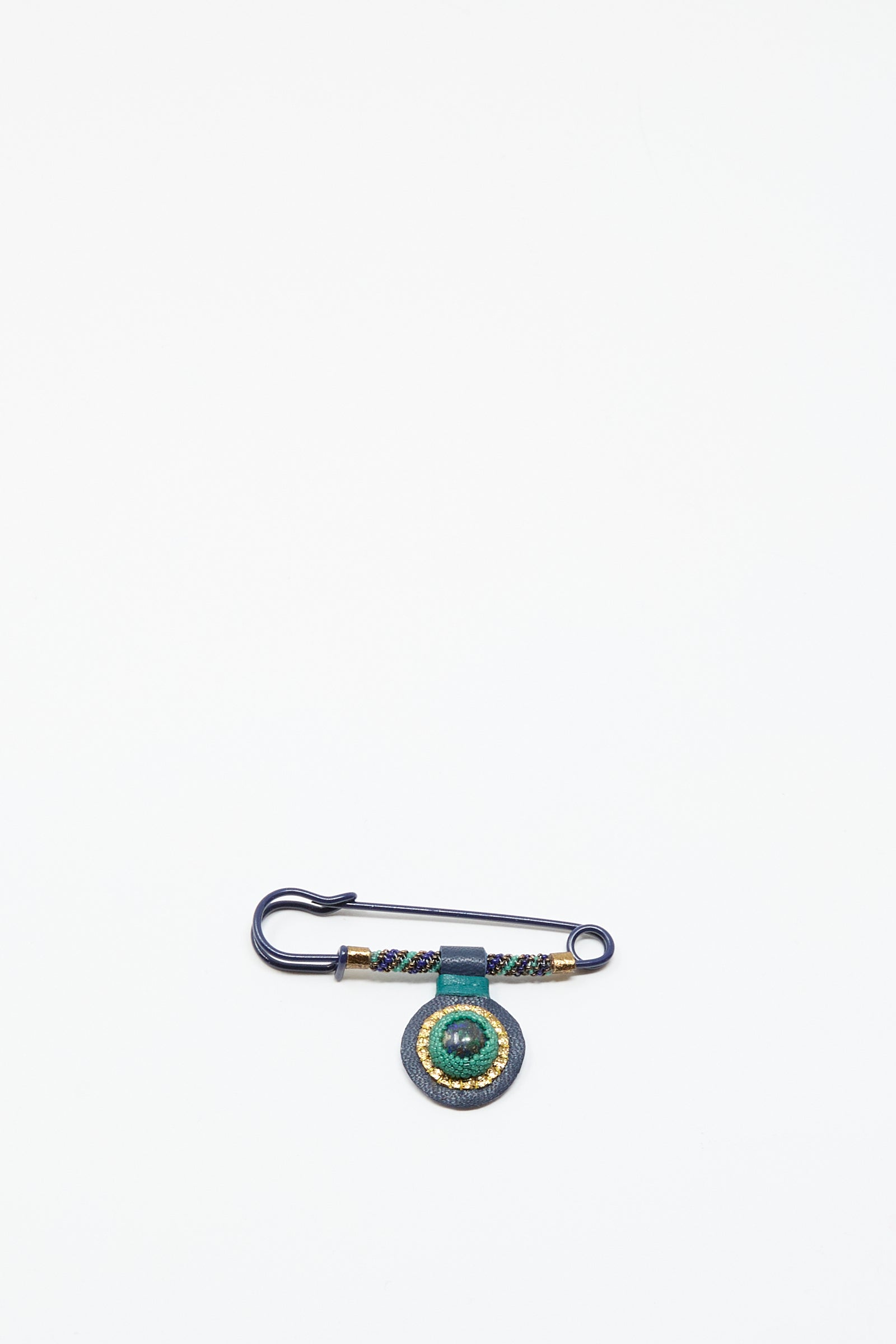 The Robin Mollicone Gem Drop Safety Pin in Blue with Azurite features antique glass beads and a green circular ornament, displayed on a white background.