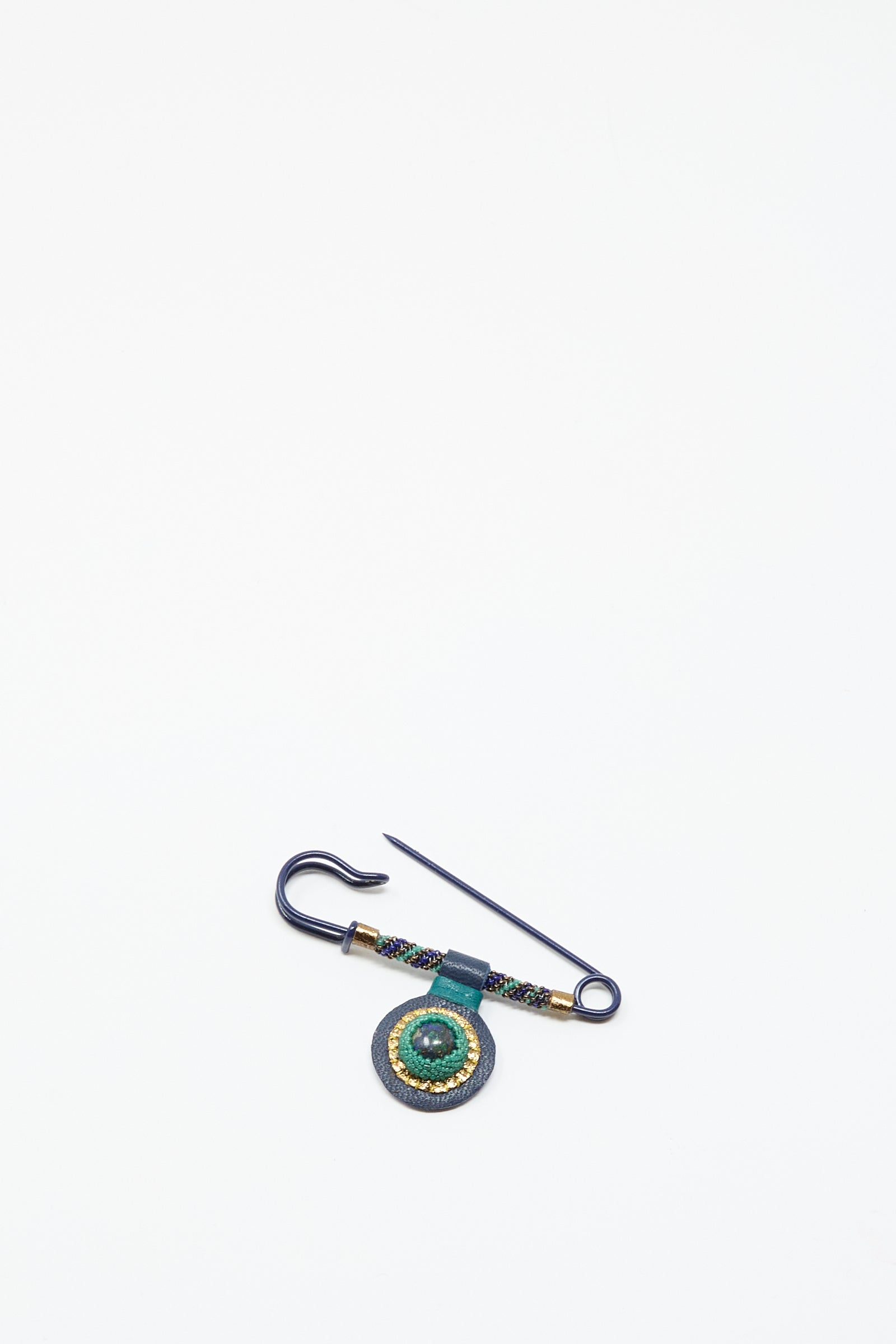 The Robin Mollicone Gem Drop Safety Pin in Blue with Azurite features a hook and a round, beaded green and gold ornament made from antique glass beads, displayed on a plain white background.