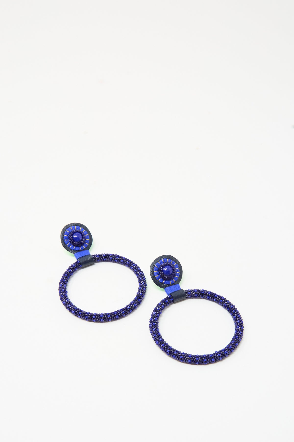 Robin Mollicone Large Beaded Hoops in Blue Lapis, featuring dark blue Lapis rings suspended from circular, bead-embellished posts.