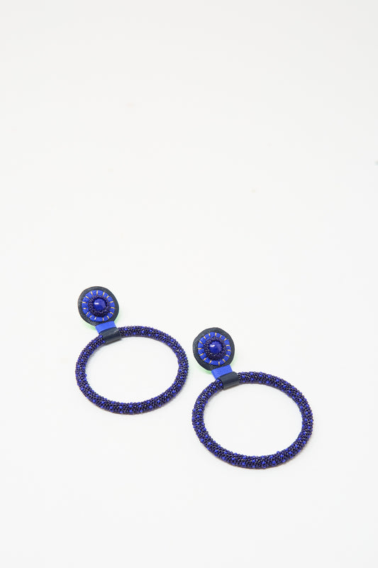 Robin Mollicone Large Beaded Hoops in Blue Lapis, featuring dark blue Lapis rings suspended from circular, bead-embellished posts.