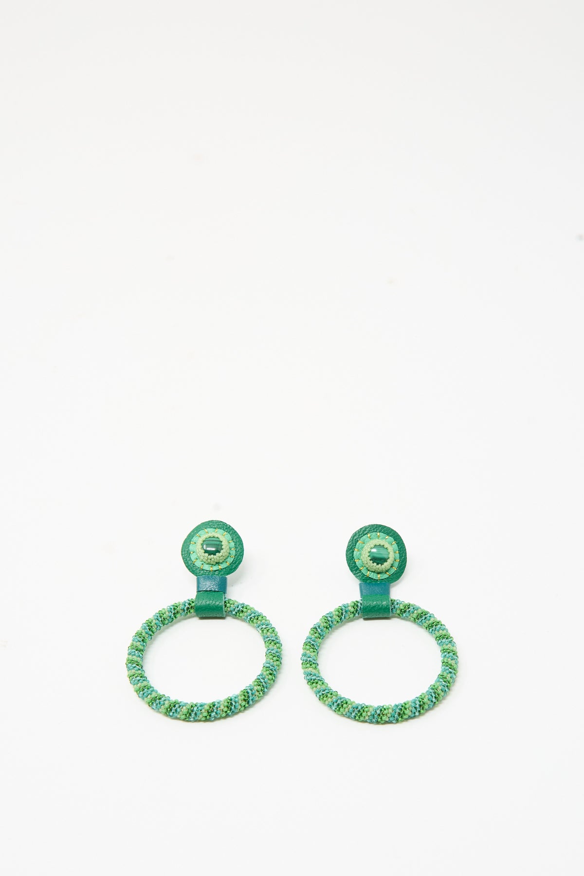 Robin Mollicone Medium Beaded Hoops in Green Malachite: two circular hoop earrings made of blue lapis and green woven thread, featuring a small beaded stud at the top.
