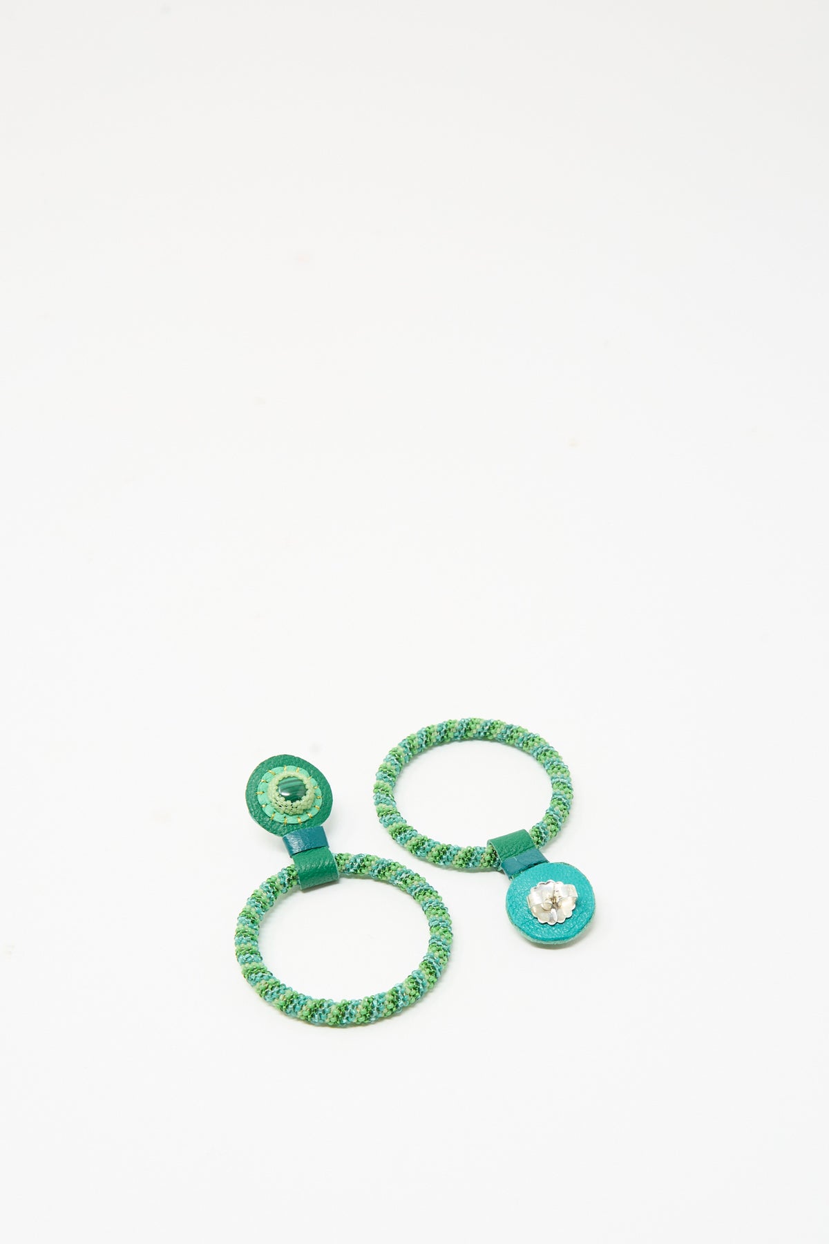 Robin Mollicone Medium Beaded Hoops in Green Malachite, featuring two circular beaded hoop earrings in green and teal cord with a flat decorative disc at the post.