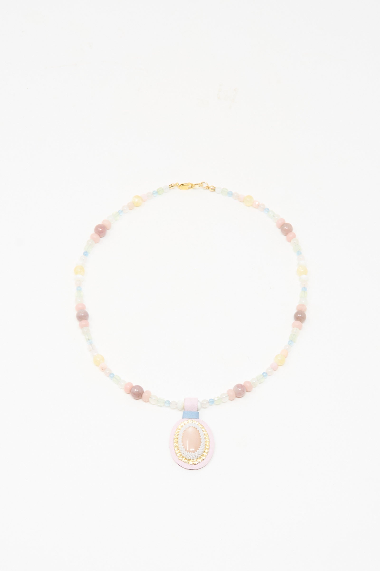 The Love Bead Charm Necklace in Pink Moonstone by Robin Mollicone features vintage pastel glass beads and a central pink moonstone pendant, beautifully displayed on a white background.
