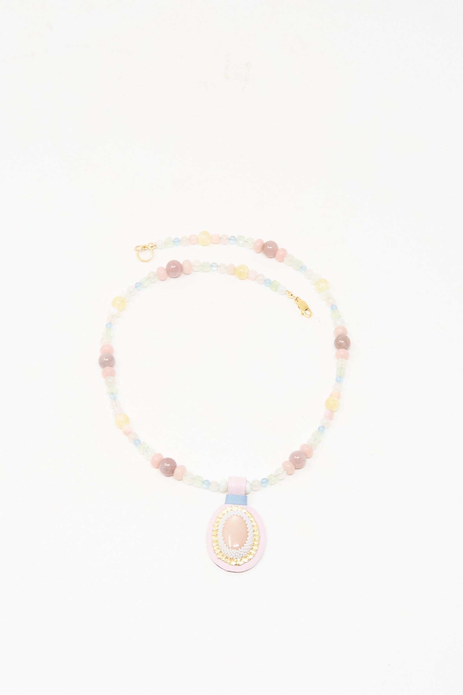 The Robin Mollicone Love Bead Charm Necklace in Pink Moonstone features pastel vintage glass beads and a central pink moonstone pendant, shown on a white background.