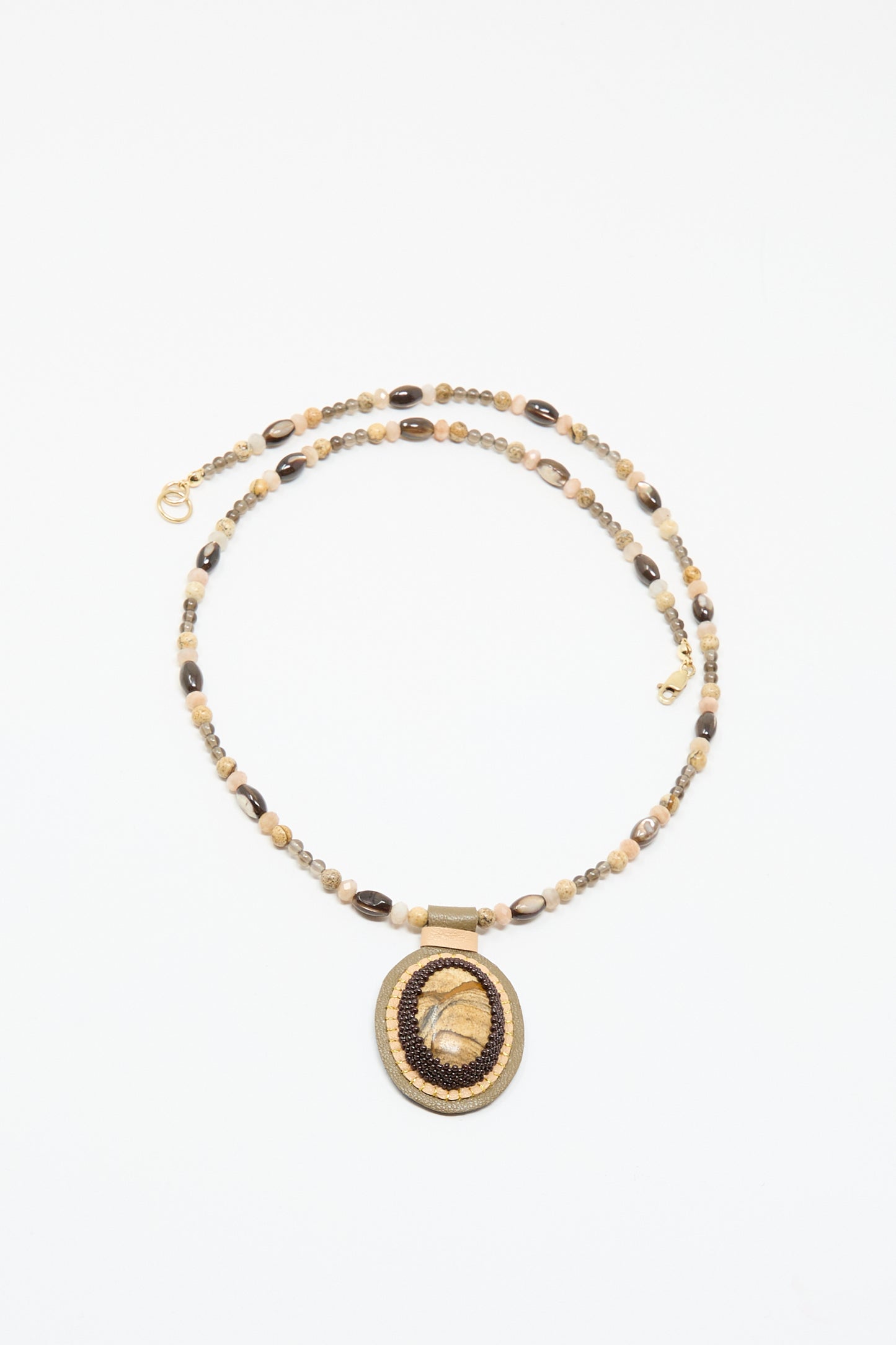 The Love Bead Necklace in Brown by Robin Mollicone features a picture jasper charm, adding unique style and earthy elegance to any outfit.