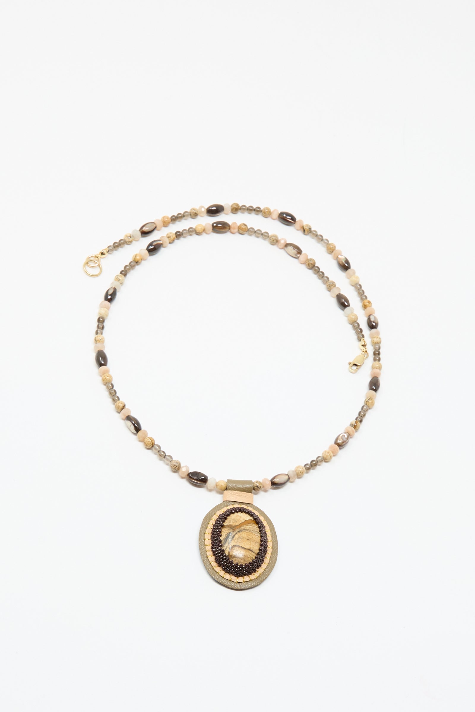 The Love Bead Necklace in Brown by Robin Mollicone features a picture jasper charm, adding unique style and earthy elegance to any outfit.