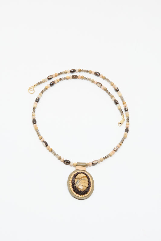 The Love Bead Necklace in Brown by Robin Mollicone features a picture jasper charm, adding unique style and earthy elegance to any outfit.