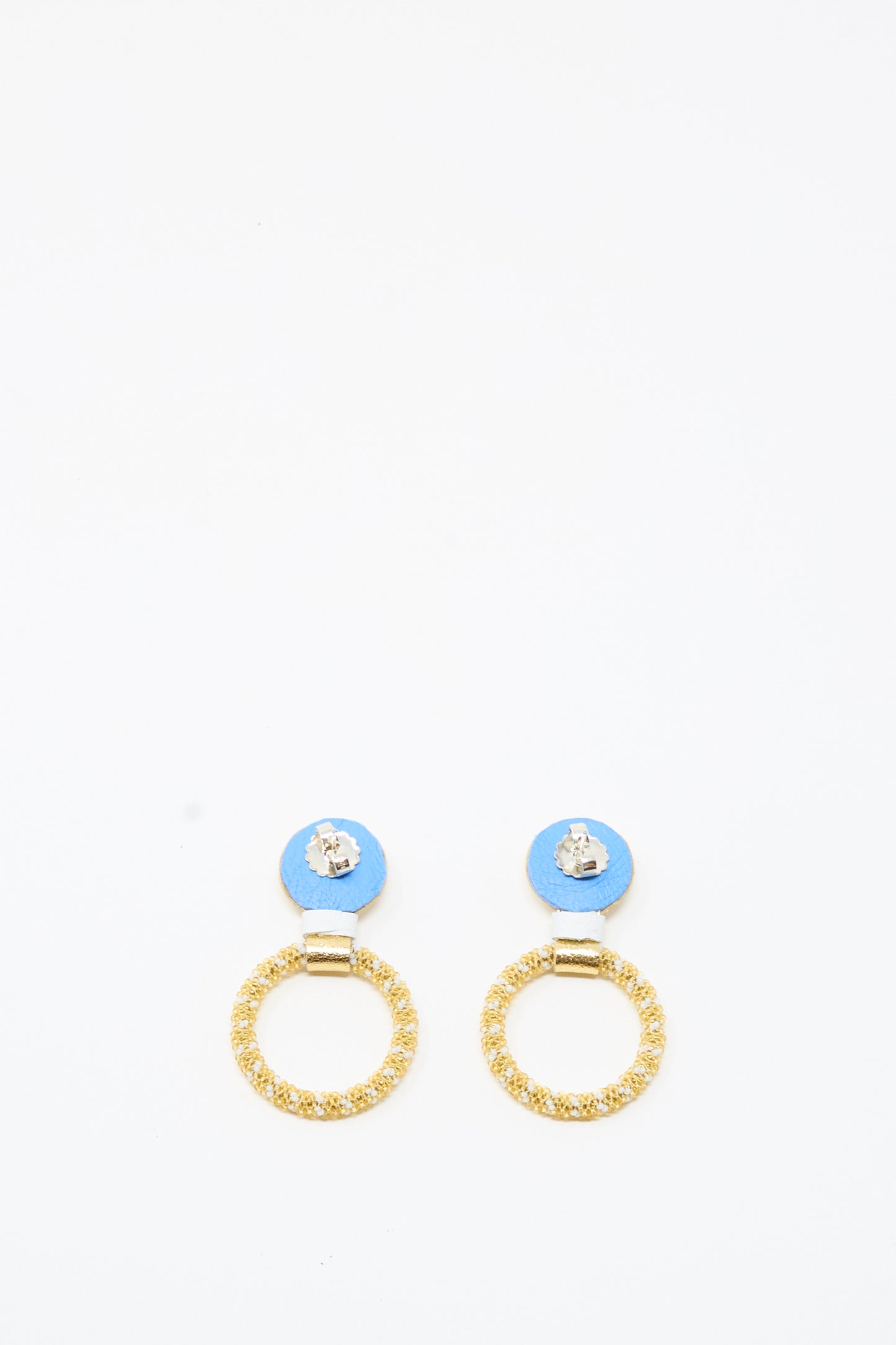 A pair of Mother of Pearl Small Beaded Hoop Earrings in Pearl and Gold by Robin Mollicone, featuring blue circular tops with textured gold rings hanging below, displayed on a plain white background.