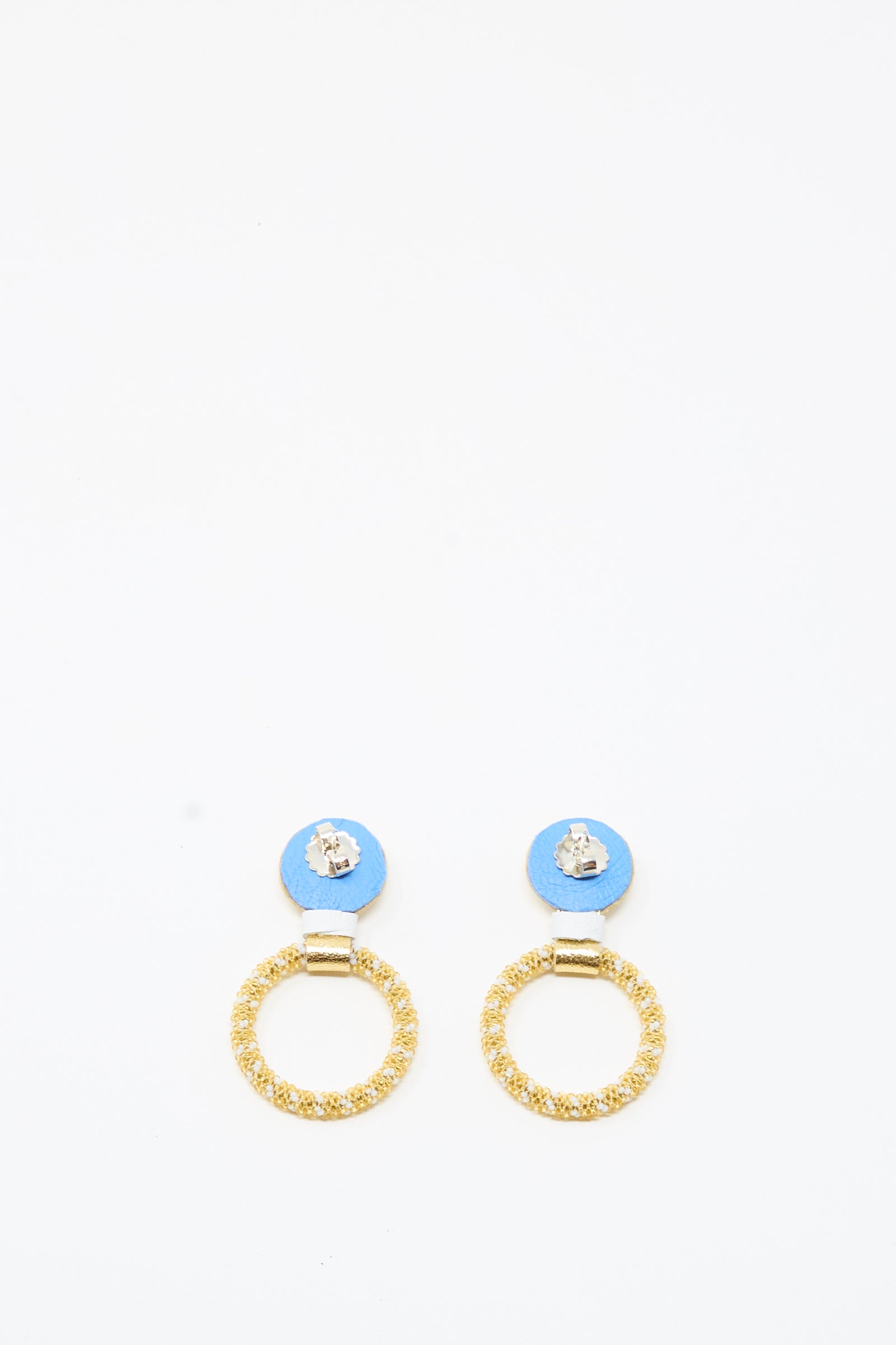 A pair of Mother of Pearl Small Beaded Hoop Earrings in Pearl and Gold by Robin Mollicone, featuring blue circular tops with textured gold rings hanging below, displayed on a plain white background.