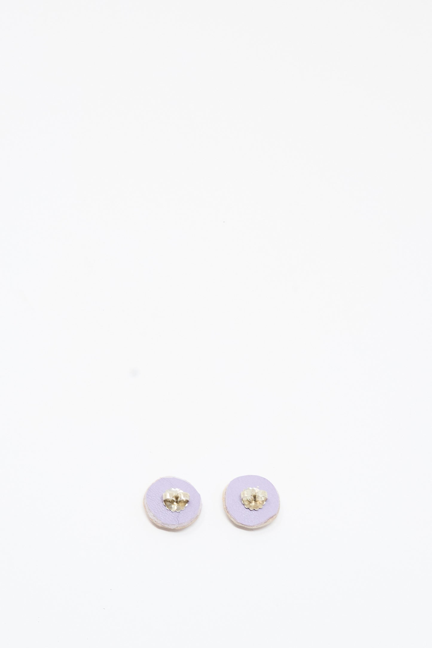 Two small, round Mother of Pearl Stud Earrings in blue and green by Robin Mollicone are placed side by side on a plain white background.