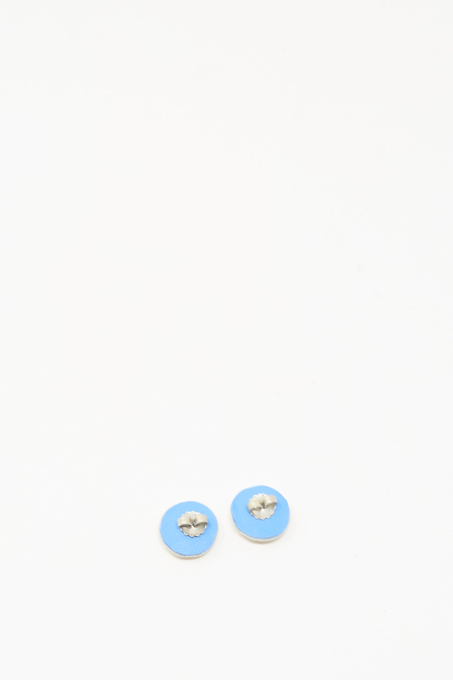 The Mother of Pearl Stud Earrings in Gold by Robin Mollicone are displayed side by side on a plain white background.