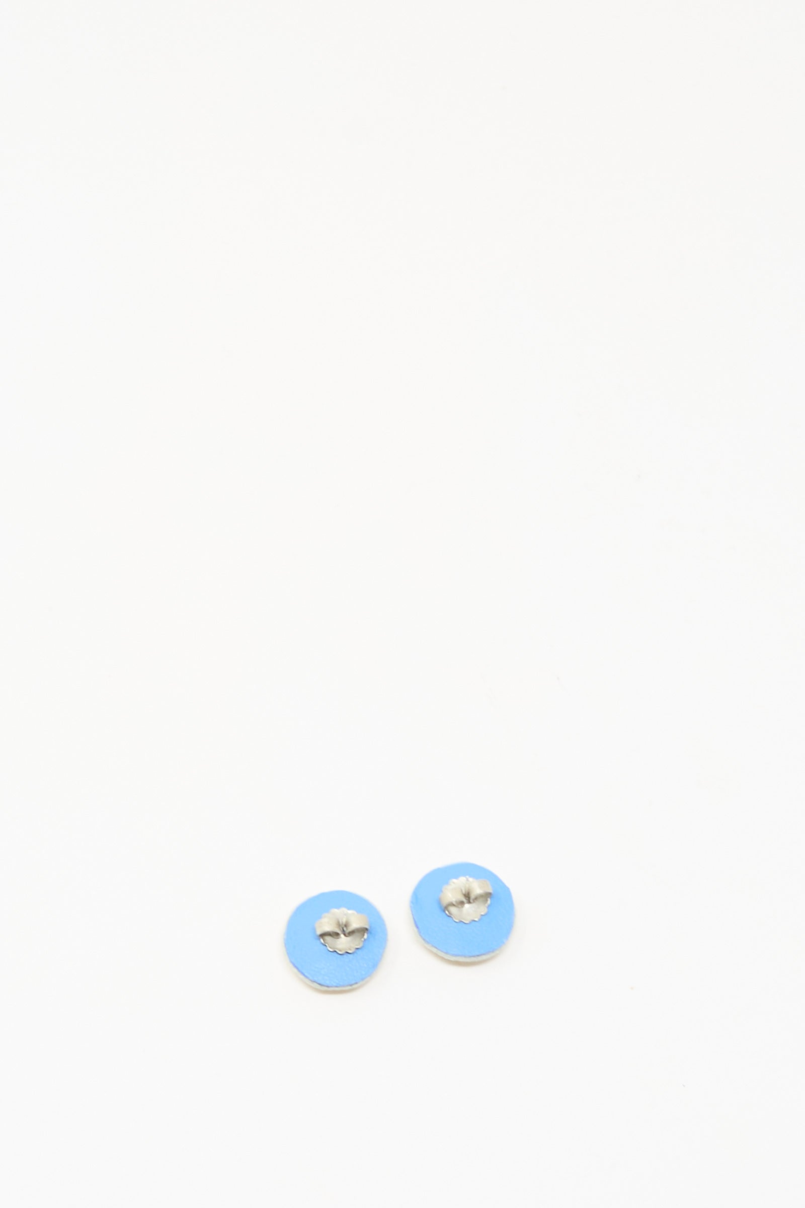 The Mother of Pearl Stud Earrings in Gold by Robin Mollicone are displayed side by side on a plain white background.