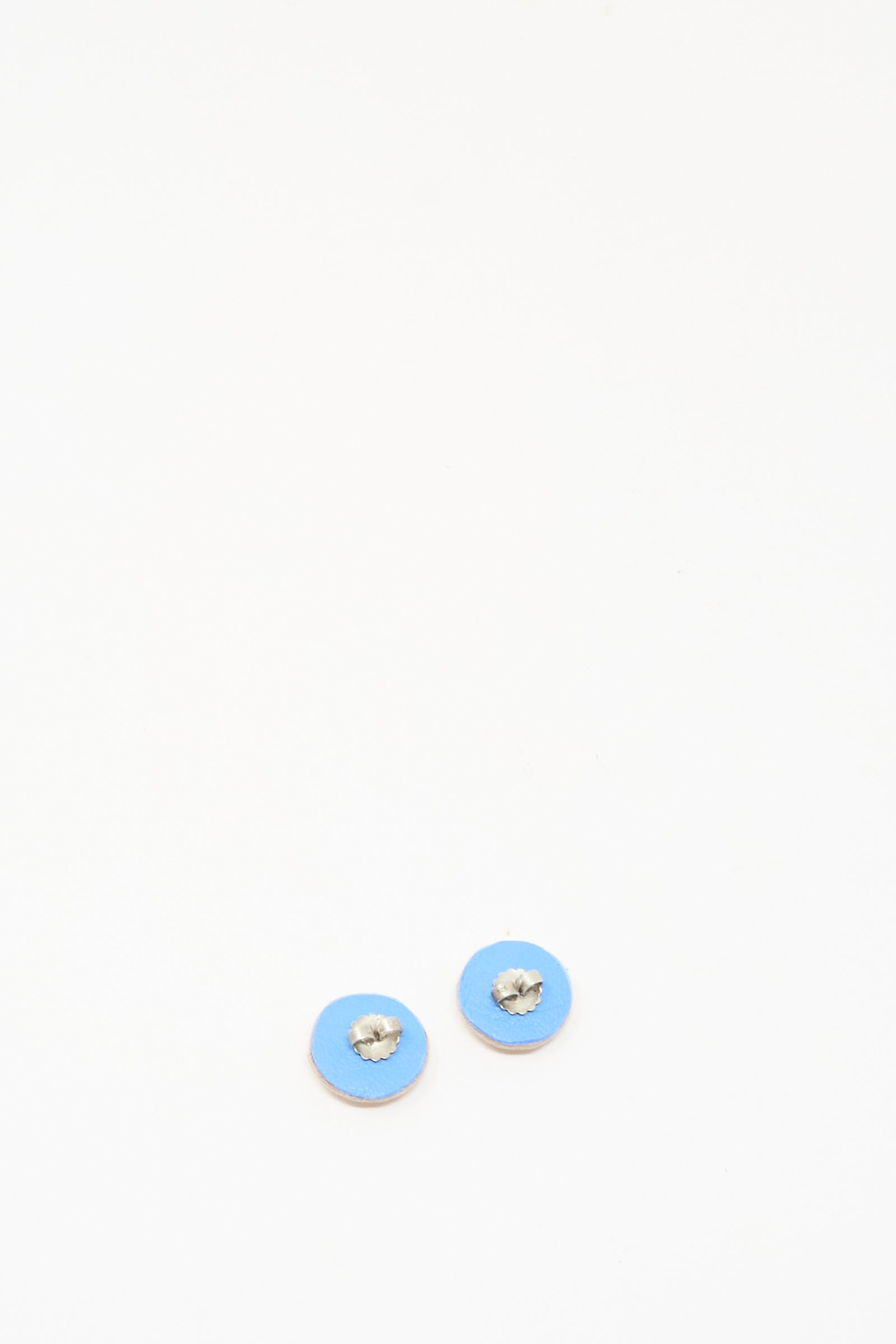 Two small round handmade Robin Mollicone Mother of Pearl Stud Earrings in pink are displayed on a white background.
