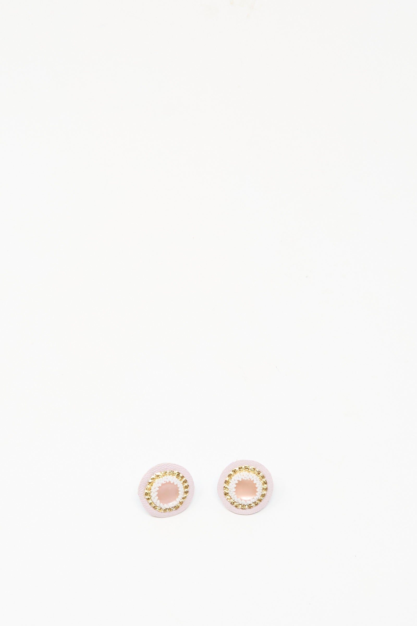 The Robin Mollicone Mother of Pearl Stud Earrings in Pink are round, gold and pink handmade studs shown on a plain white background.