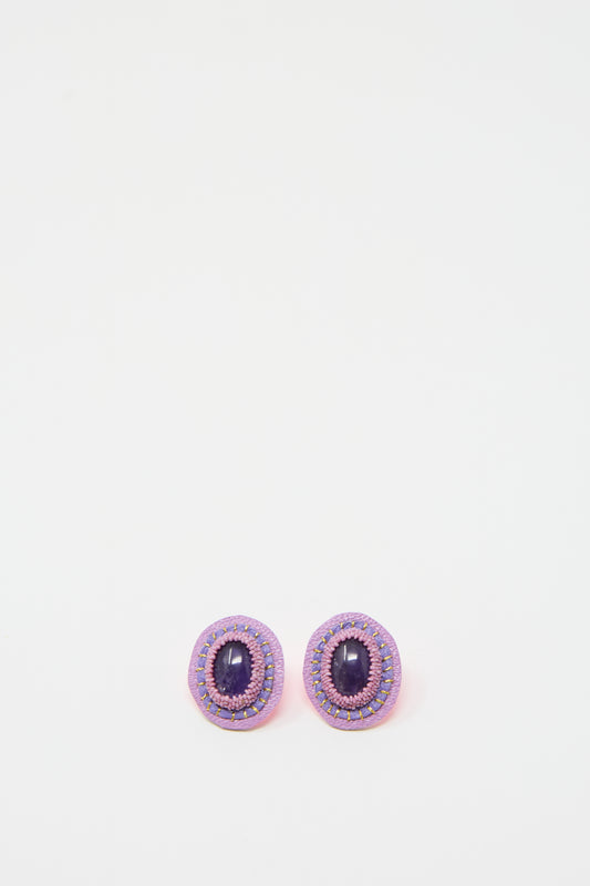 A pair of Robin Mollicone's Oval Earrings in Amethyst, featuring intricate detailing and set in sterling silver, placed side by side on a plain white background.