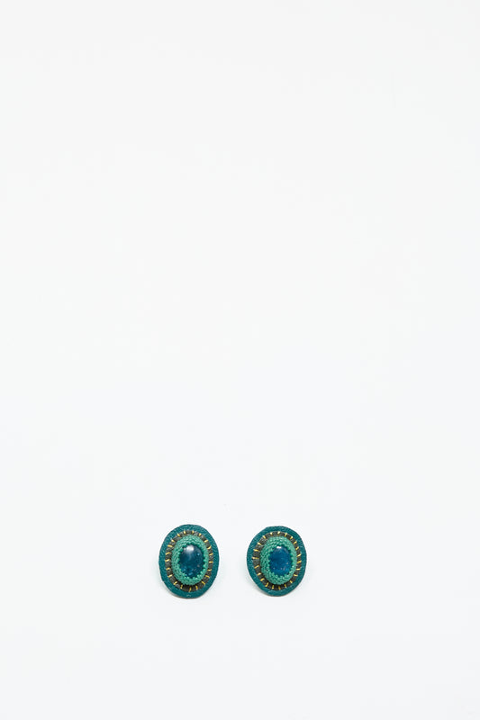 A pair of oval Apatite earrings by Robin Mollicone with gold accents are displayed side by side on a plain white background.