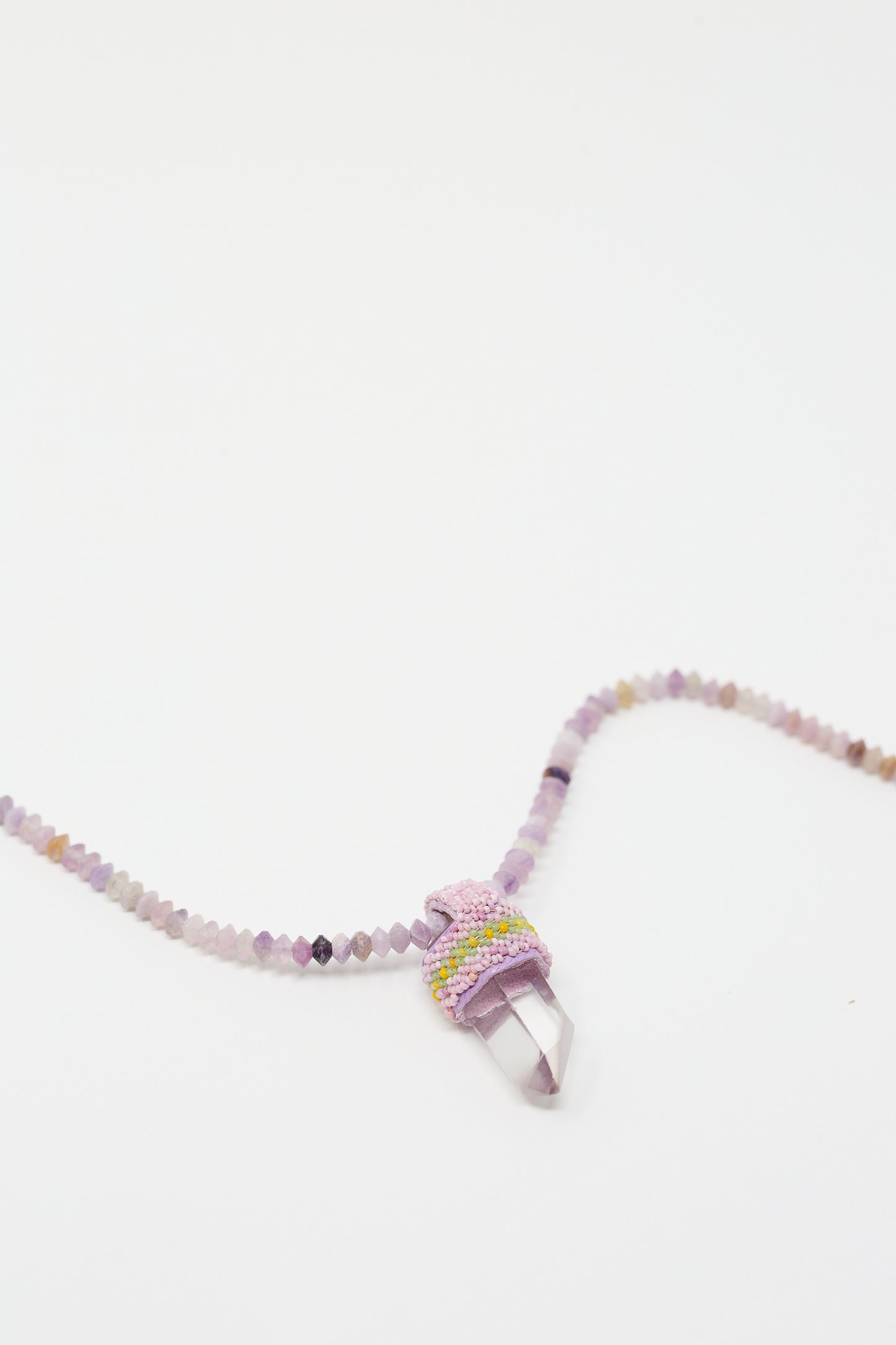 The Robin Mollicone Petite Pendulum Necklace in Faceted Lepidolite Beads and Quartz Crystal is displayed against a white background.